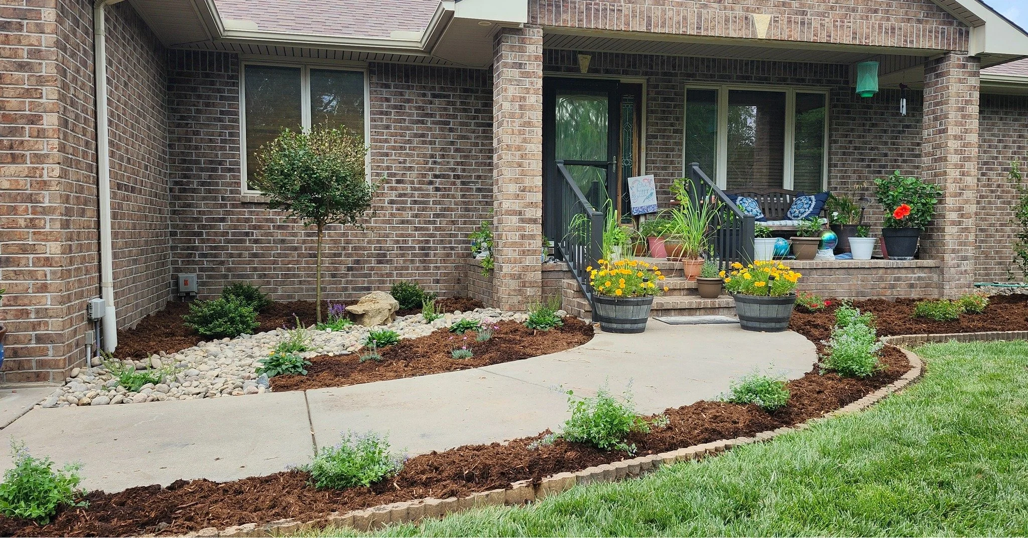 It's hot as hell out here! But we're still knocking out full landscapes like this one. This customer wanted to keep the same bed shape and edging but with all new plants. The old shrubs were about 20 years old. We used the tractor to remove all the o