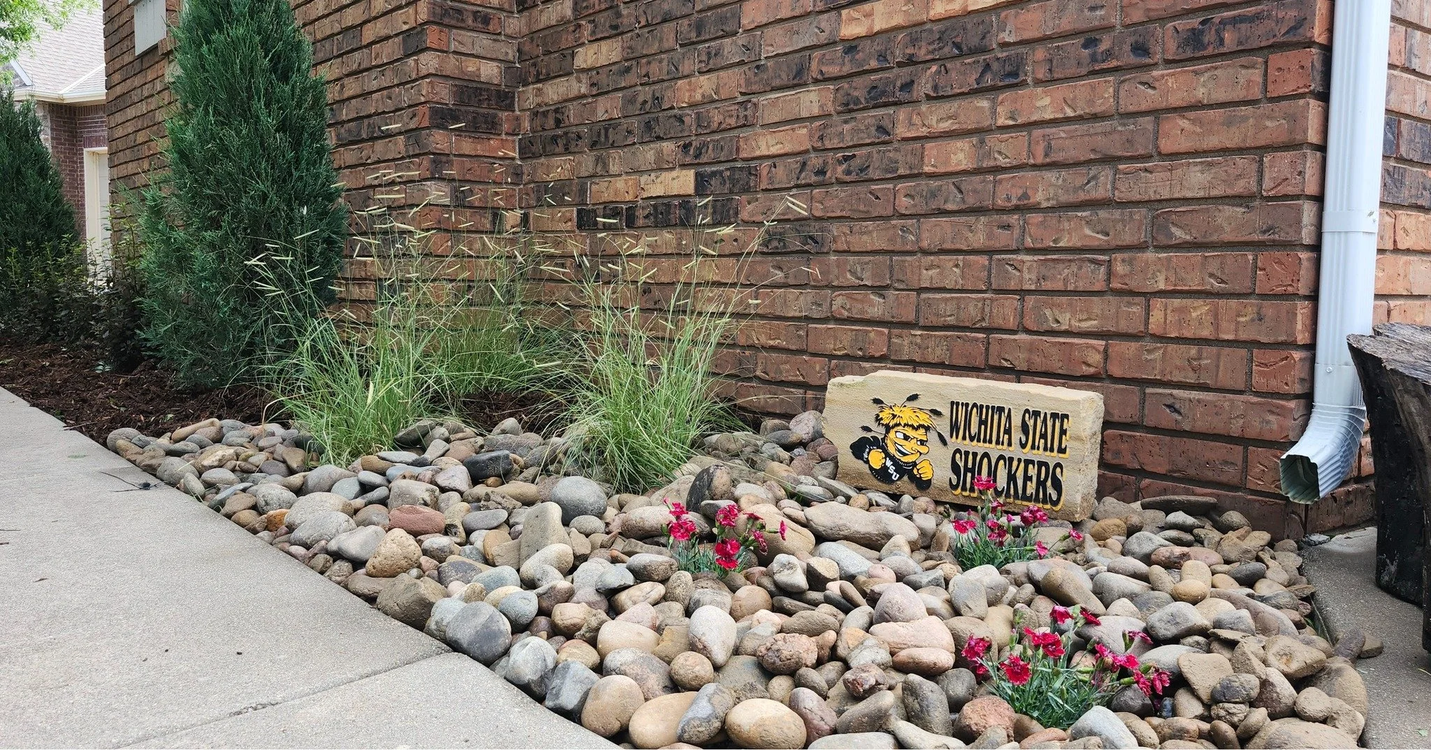 The rain definitely slowed us down on this project. That said, the end result was totally worth the wait! The customer wanted silver mound artemisia in the plan and I'm glad she spoke up. The light color really pops in the dappled sun and I love how 