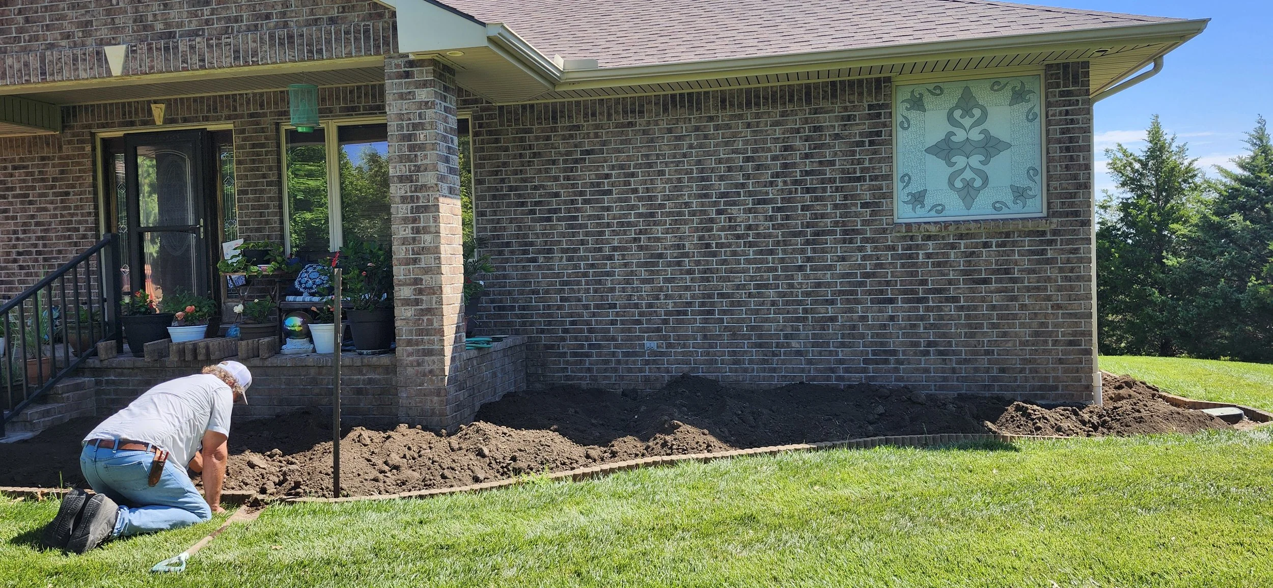 The Importance of Proper Drainage and Grading Before Planting Shrubs and Flowers