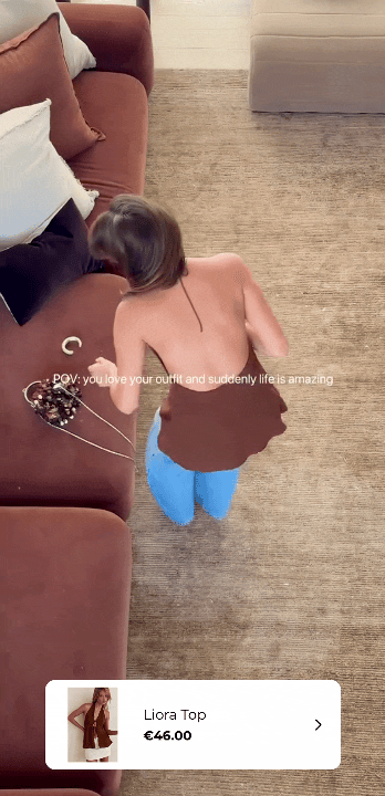 Shoppable Instagram video showing a women modelling a brown top, powered by the Instafeed app.