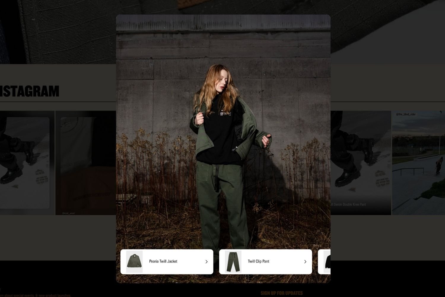 Shoppable Instagram post on the CAT brand website showing a women wearing matching trousers and jacket.