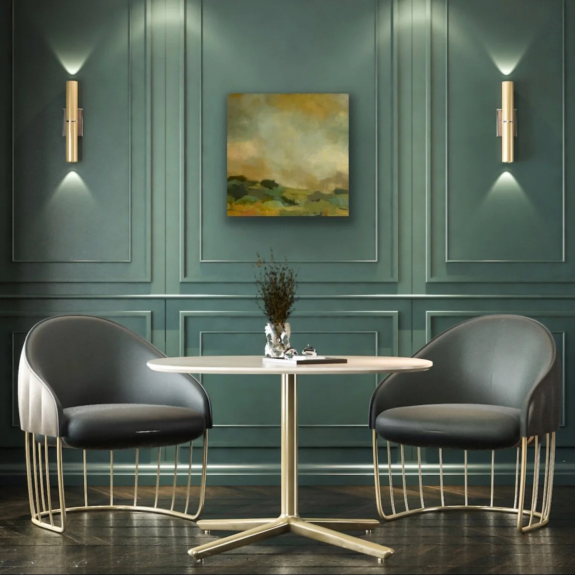 abstract landscape painting in shades of gold and green on a teal wall