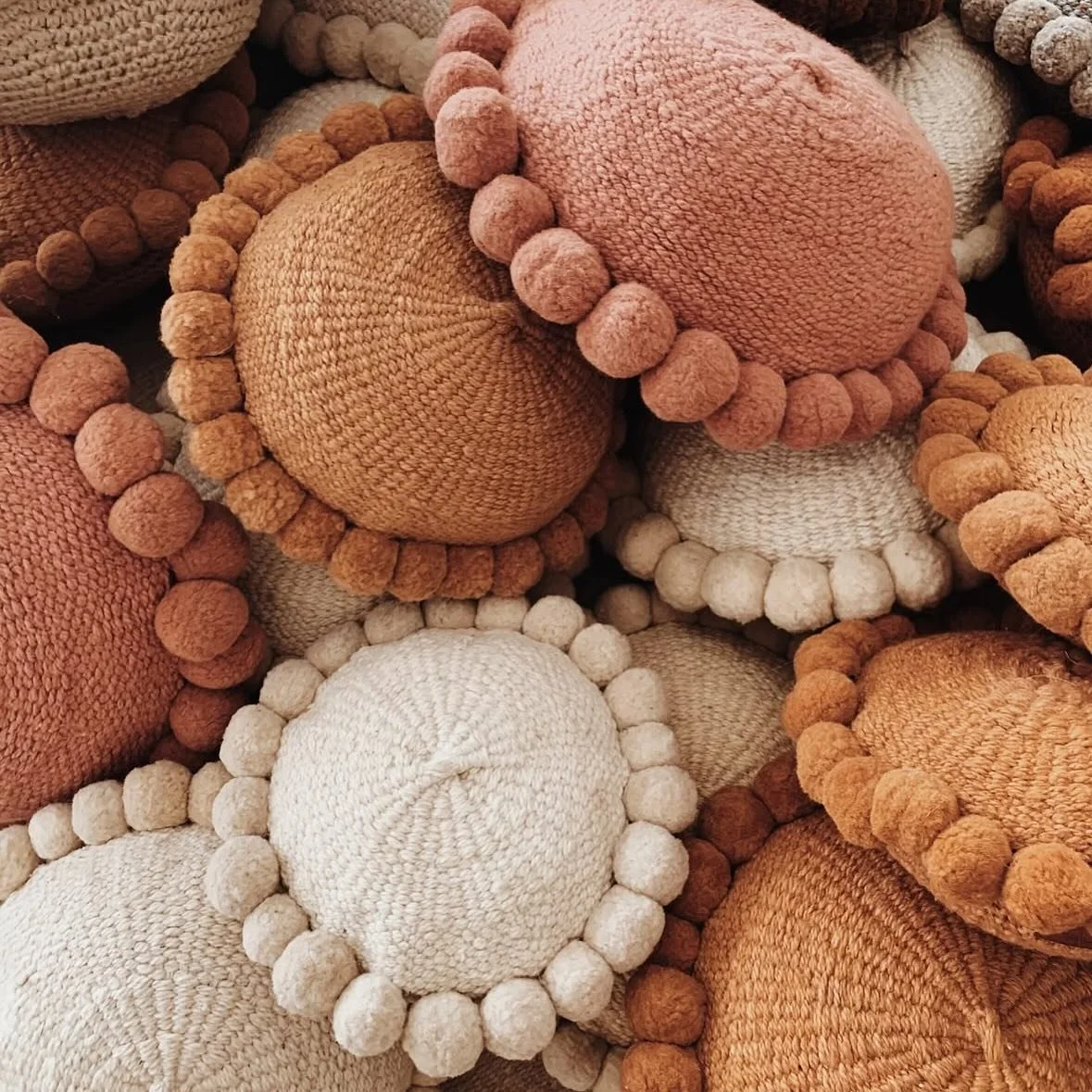 Soft texture &amp; timeless design - our signature Valle Pom Pom cushion 🤎

@andesdesign