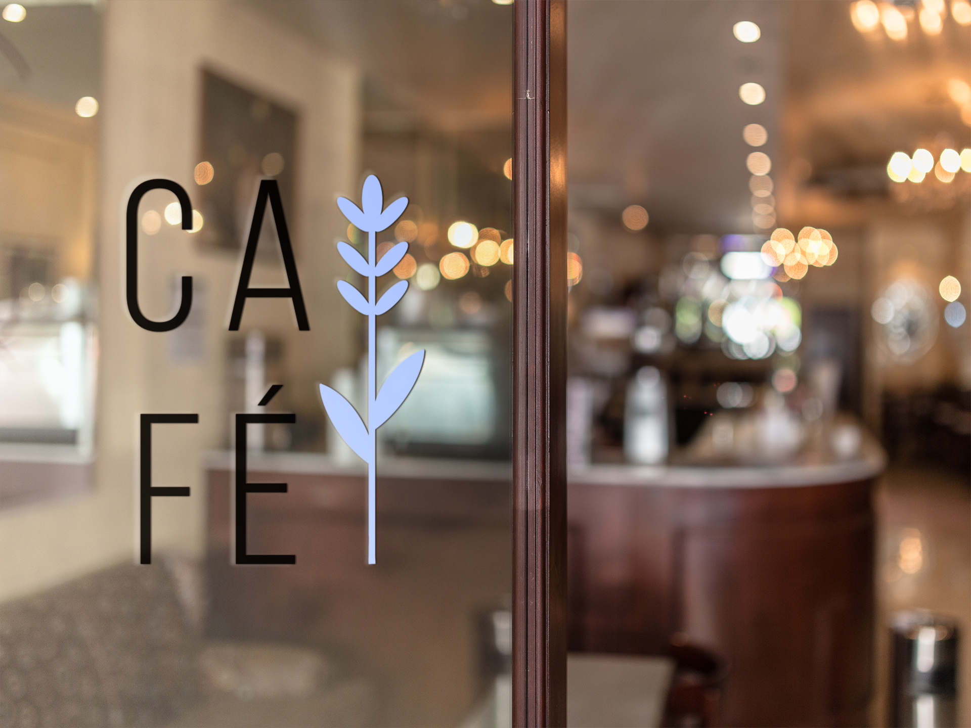 Glass door with the word 'CAFÉ' and a blue plant logo, with a blurred indoor scene including warm lighting and tables in the background.