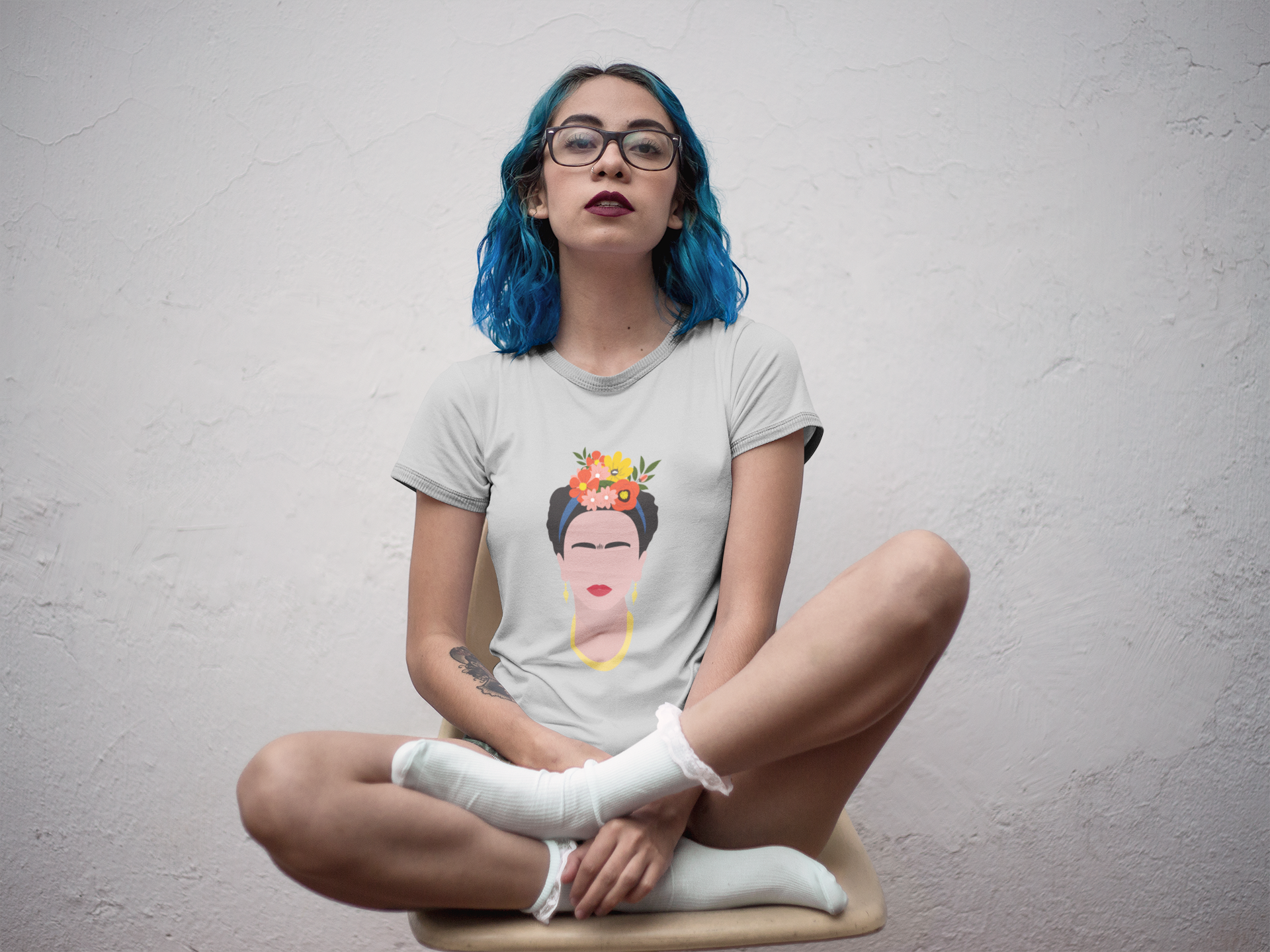 mockup-of-a-hispanic-tattooed-girl-wearing-a-ringer-tshirt-mockup-while-sitting-on-a-yellow-chair-a17002.png