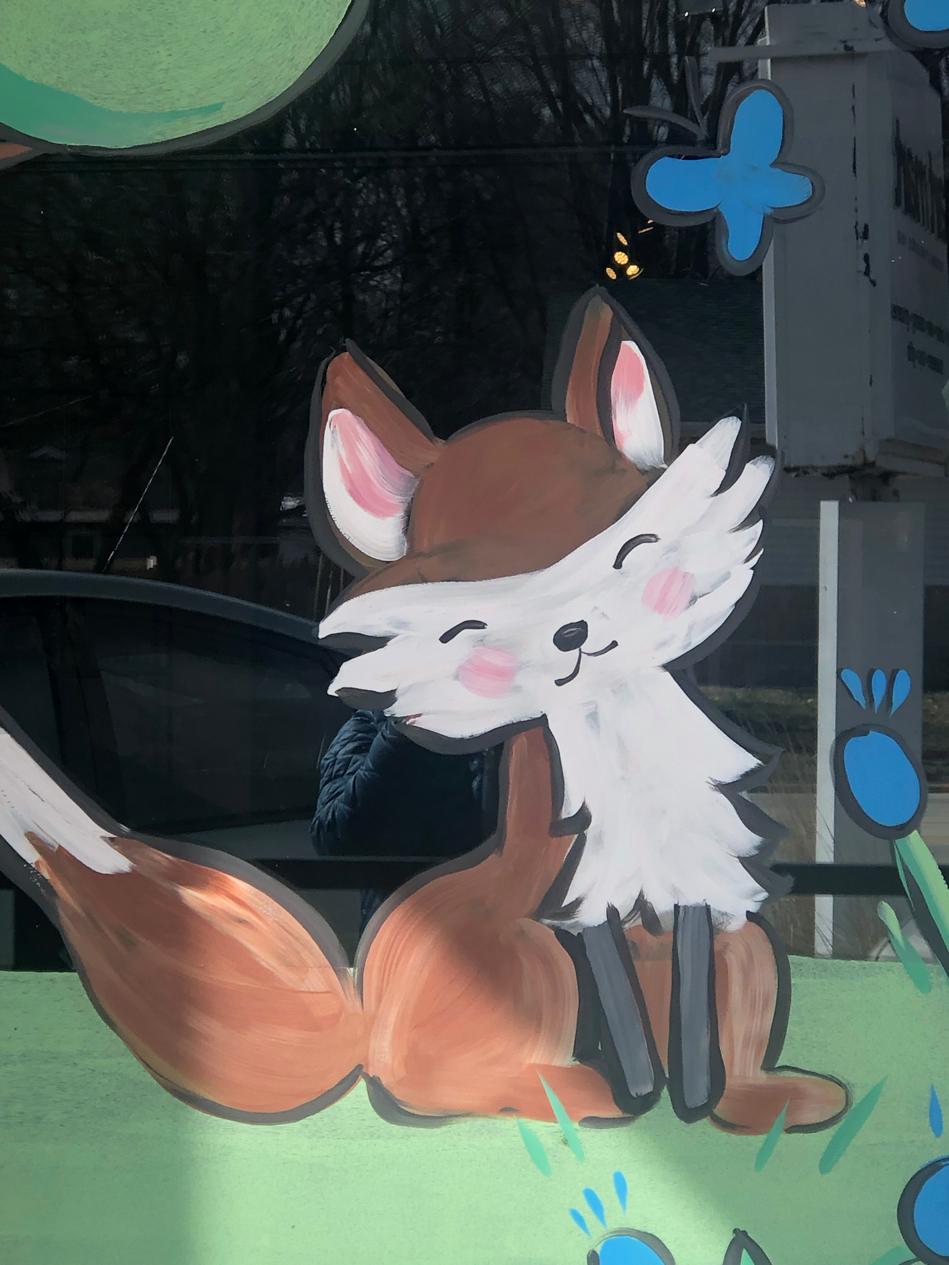 Window painting at Art Mart. Champaign, Illinois. Spring window painting 2023