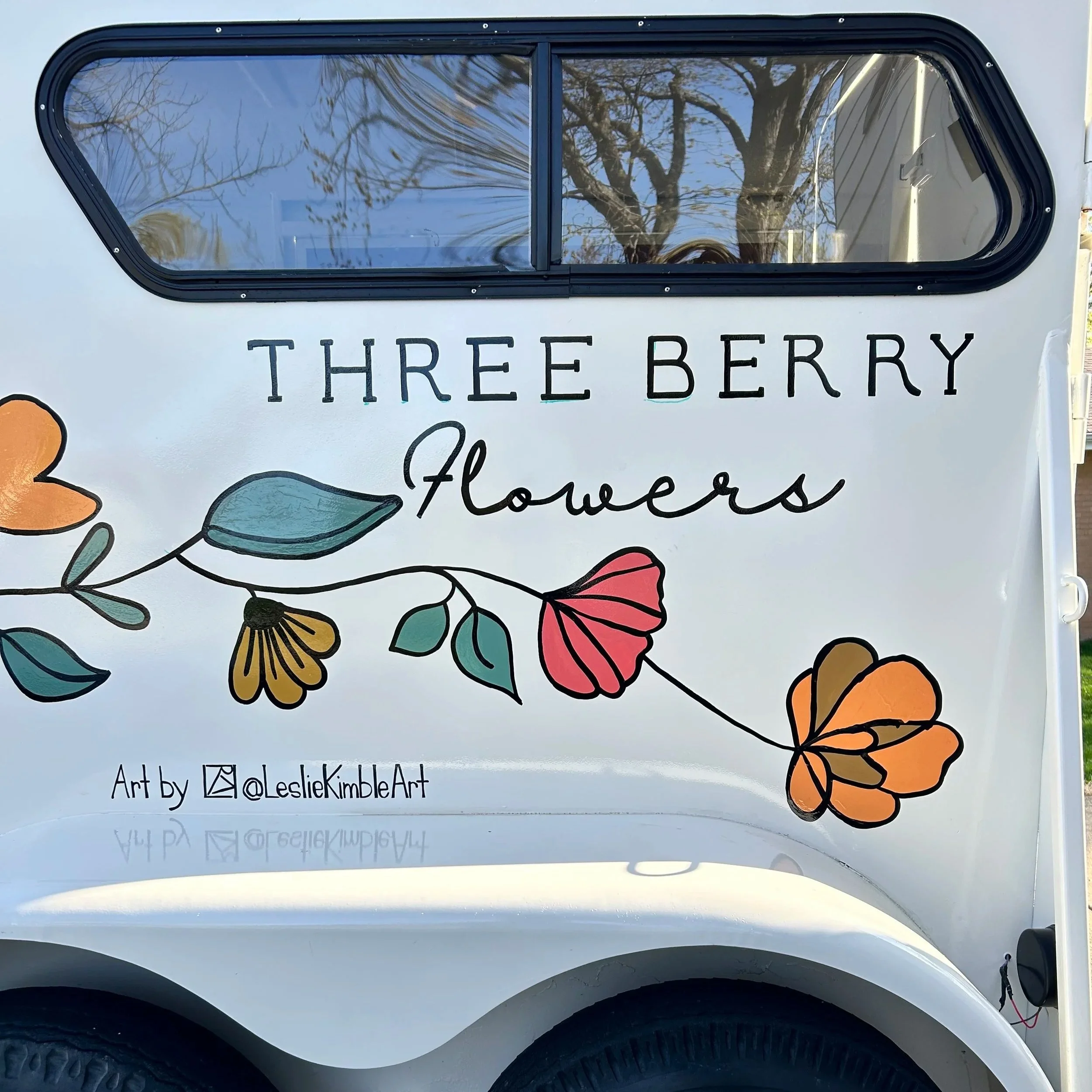 Painted flower trailer converted from an old horse trailer. Three Berry Flowers collaboration with Leslie Kimble Art