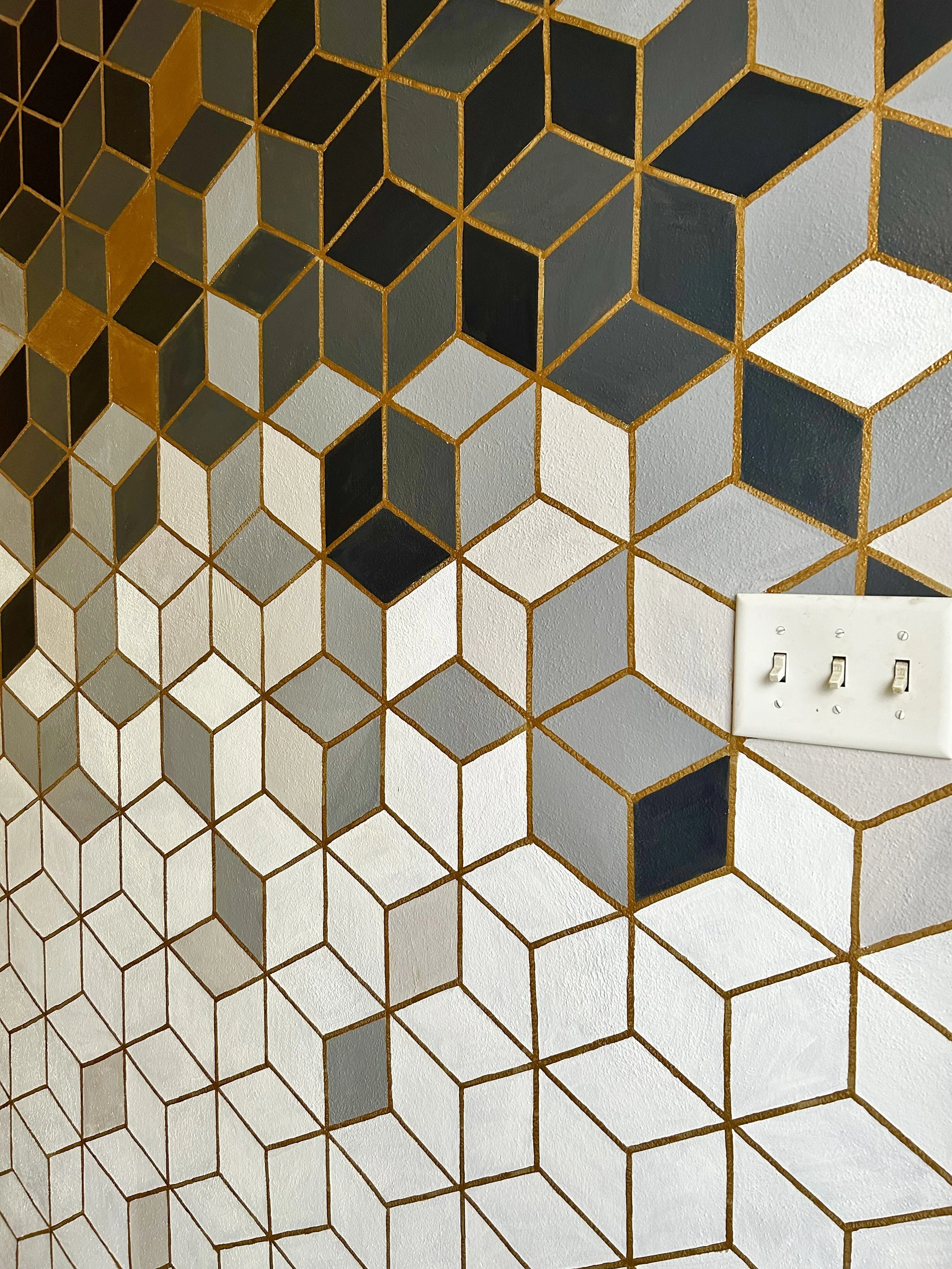 bold, moder, and sutnning golds, black, grey and white entrance mural in Champaign, Illinois