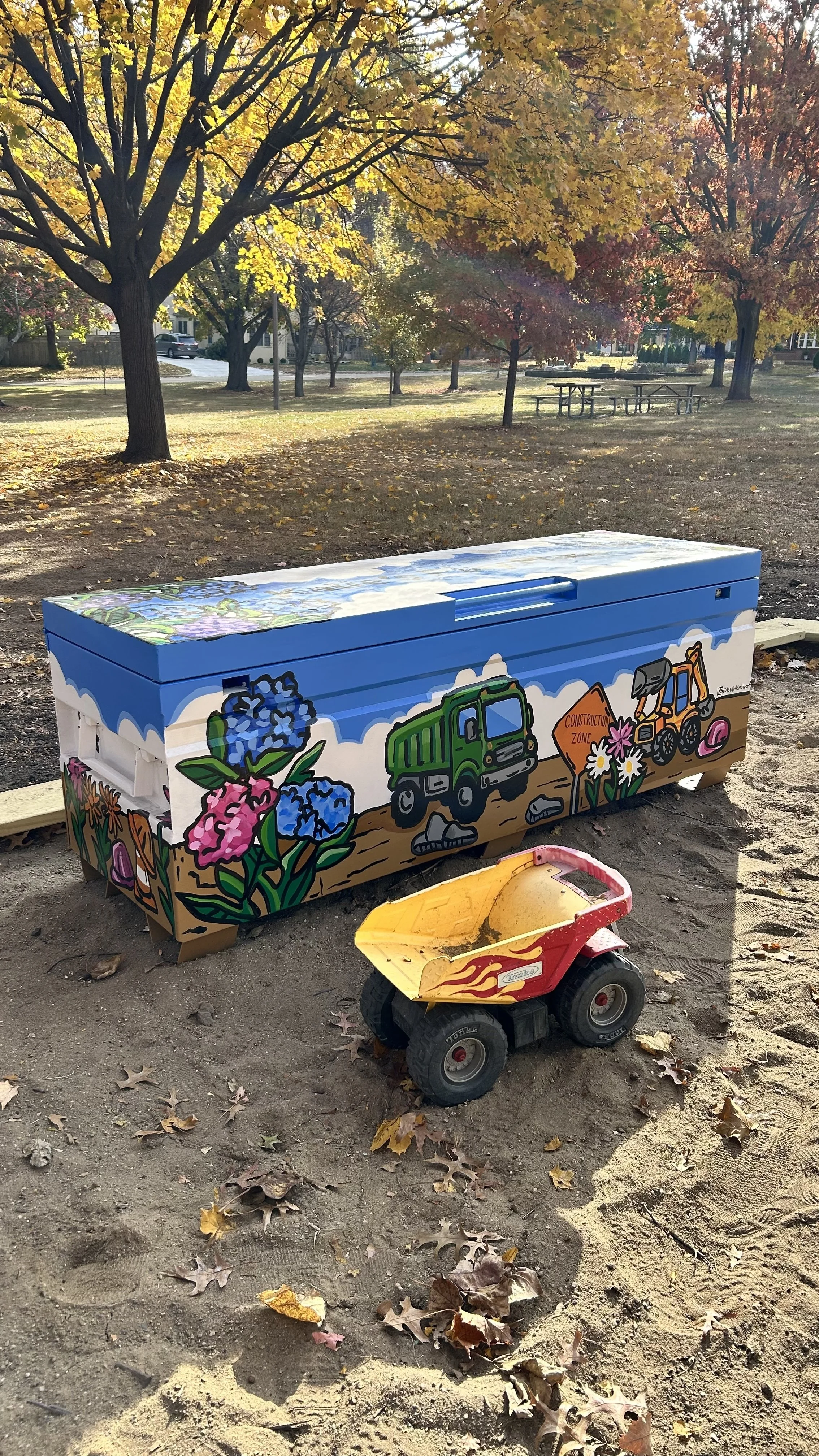 Toy box mural painted by Leslie Kimble of Leslie Kimble art for Champaign Park District Clark Park redo.