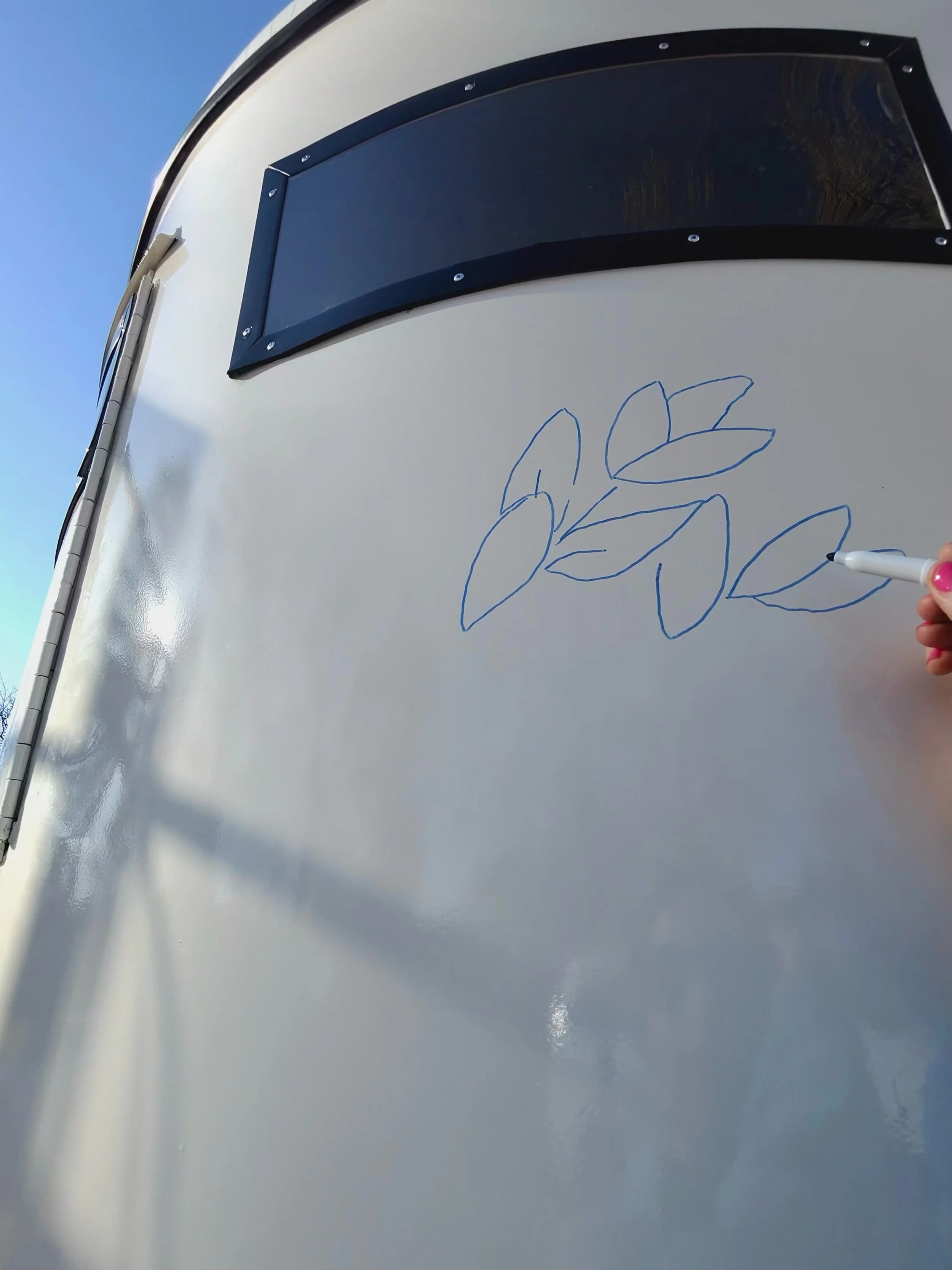 Process photo of painted flower trailer