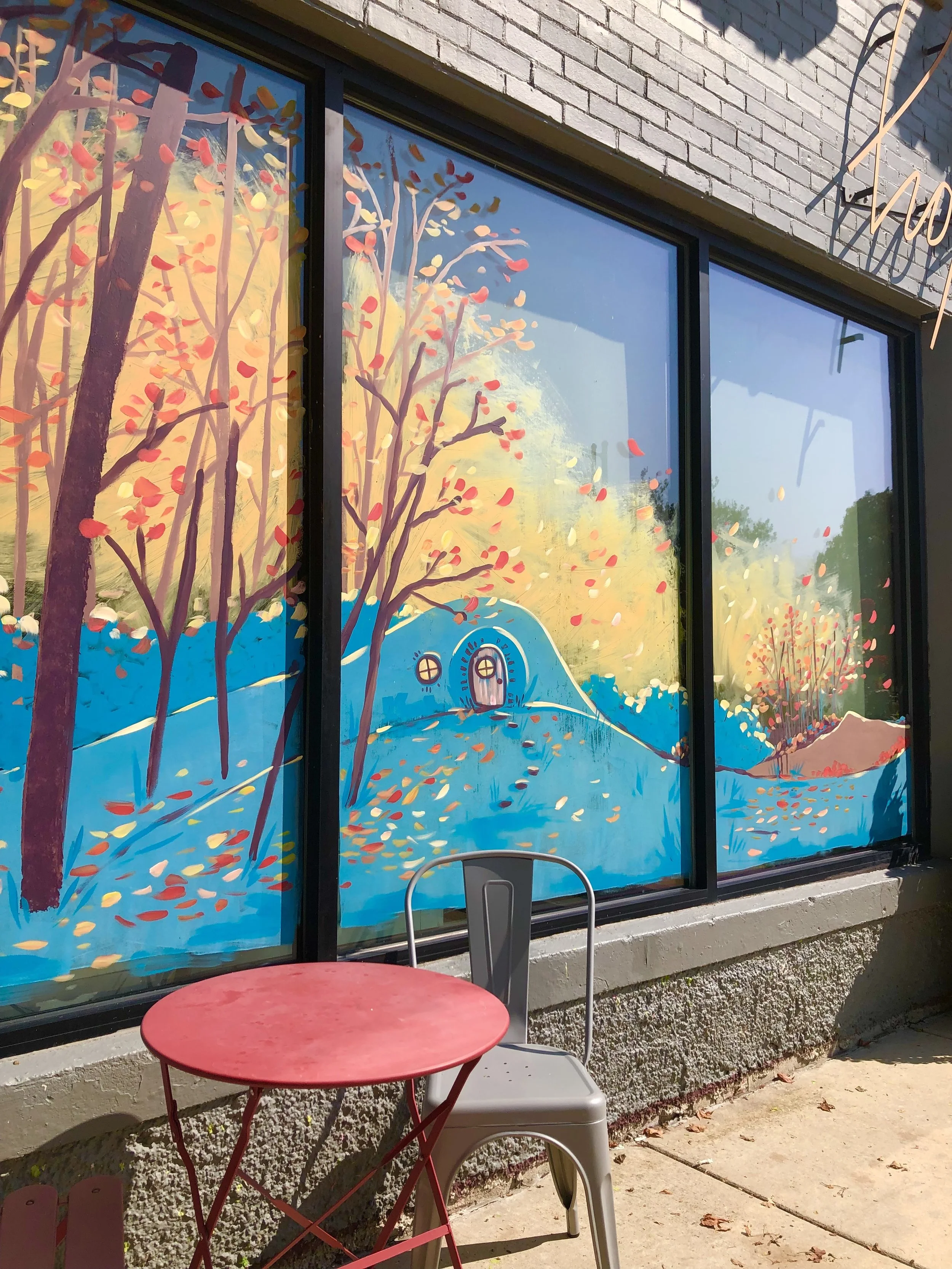Fall Hobbit Scene at Hopscotch, Champaign, Illinois. fall scene with colorful trees and reen roling hills