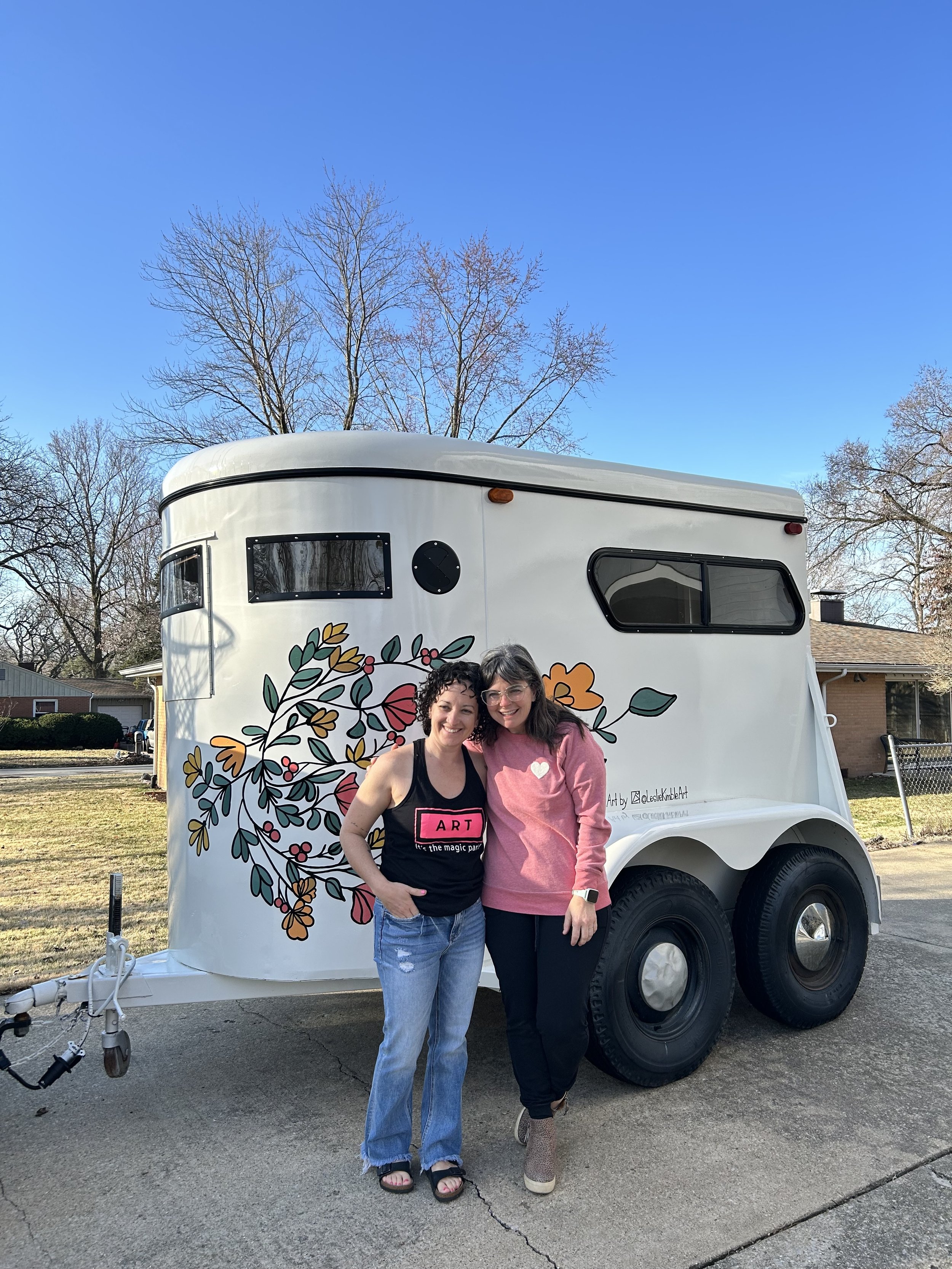 Joanna Wang and Leslie Kimble with painted flower trailer, Champaign, Illinois
