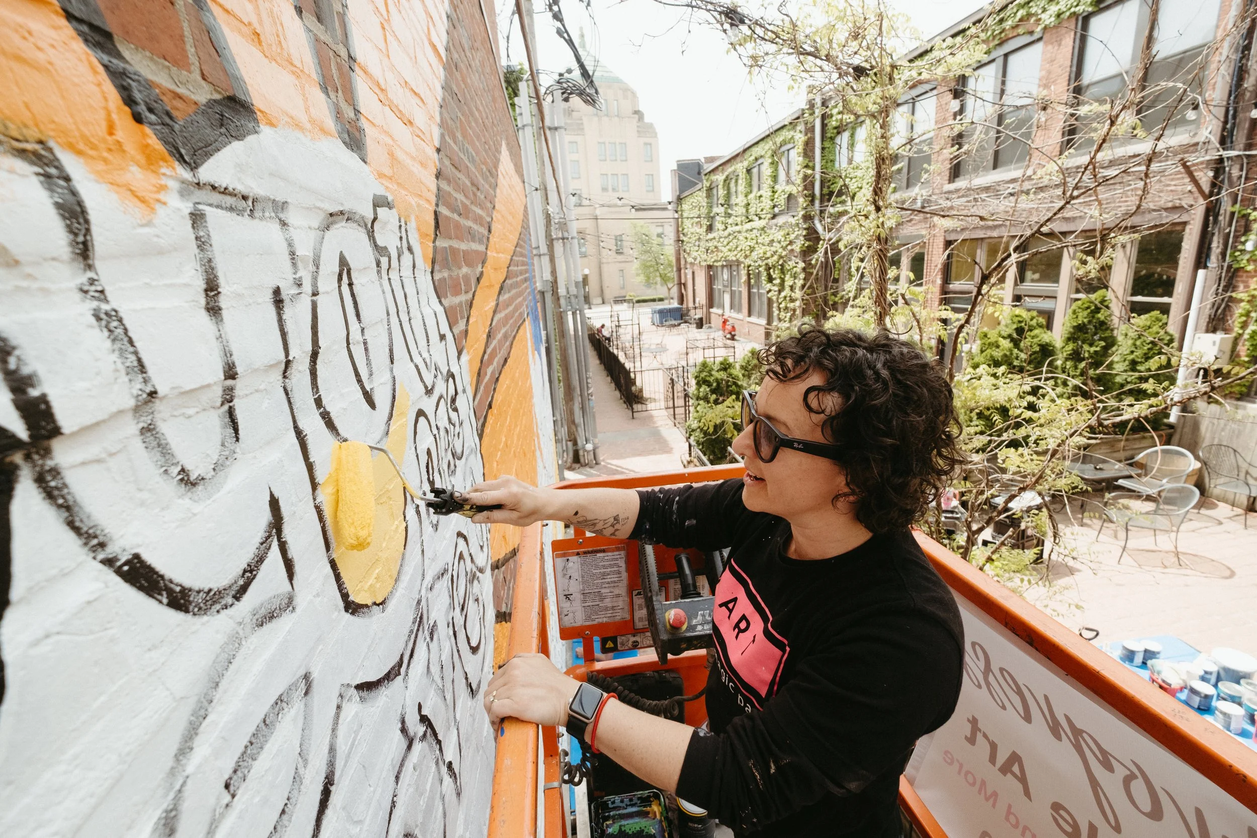 Leslie Kimble Art working on mural for C.A.S.A. and Crisis Nursery in Champaign County, Champaign, Illinois

