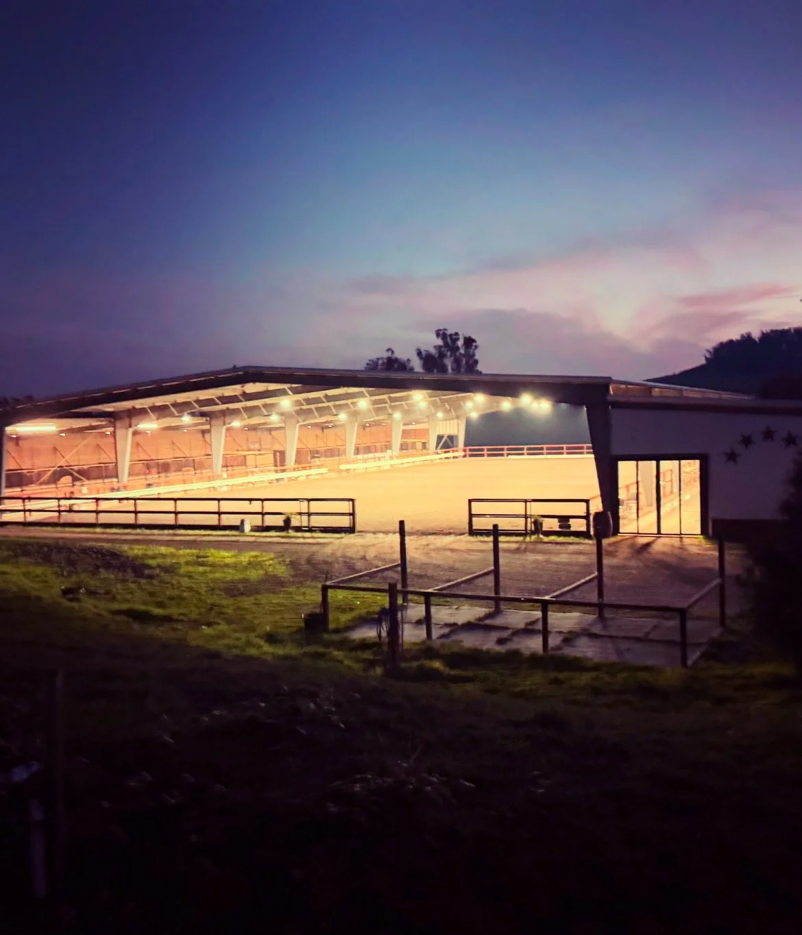 The covered arena at Jaz Creek at nighttime
