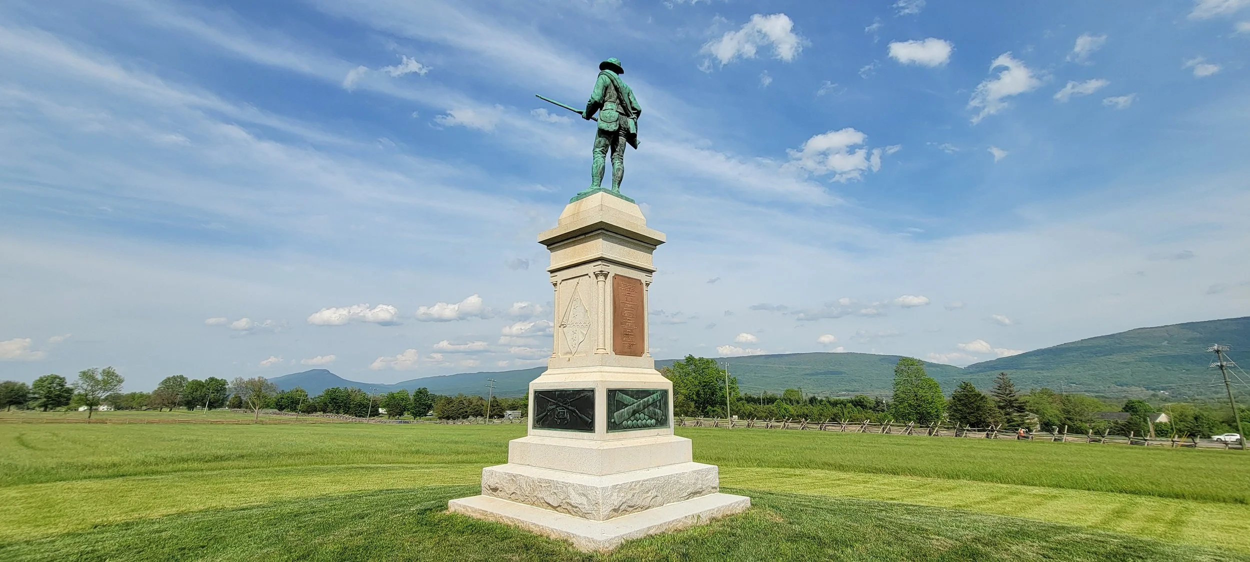 The New Market Battlefield monument with Massanutten Mountain beyond
