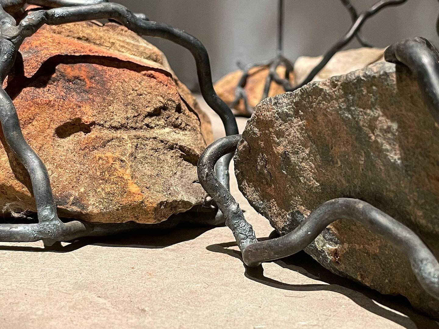 Detail shot of &ldquo;Locus&rdquo; by Ayla Gizlice @ayla_k_g, currently featured in &ldquo;Limestone Almanac.&rdquo; Rocks and plastic gathered from feeder streams to Jordan Lake, steel. 
⠀⠀⠀⠀⠀⠀⠀⠀⠀
Ayla&rsquo;s work explores local and global environm
