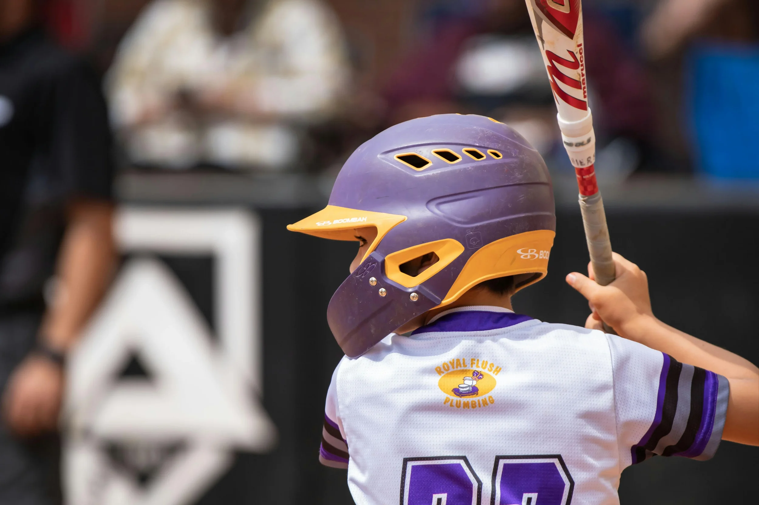 Little league player up to bat.
