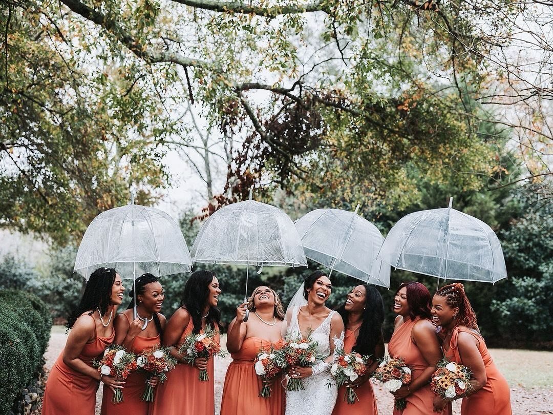 A little rain won&rsquo;t ruin her day! 
This gorgeous bride never stopped smiling, and when those rain clouds moved on so her dream ceremony could still happen at the stunning outdoor pavilion, it was confirmed that rain is indeed good luck on your 