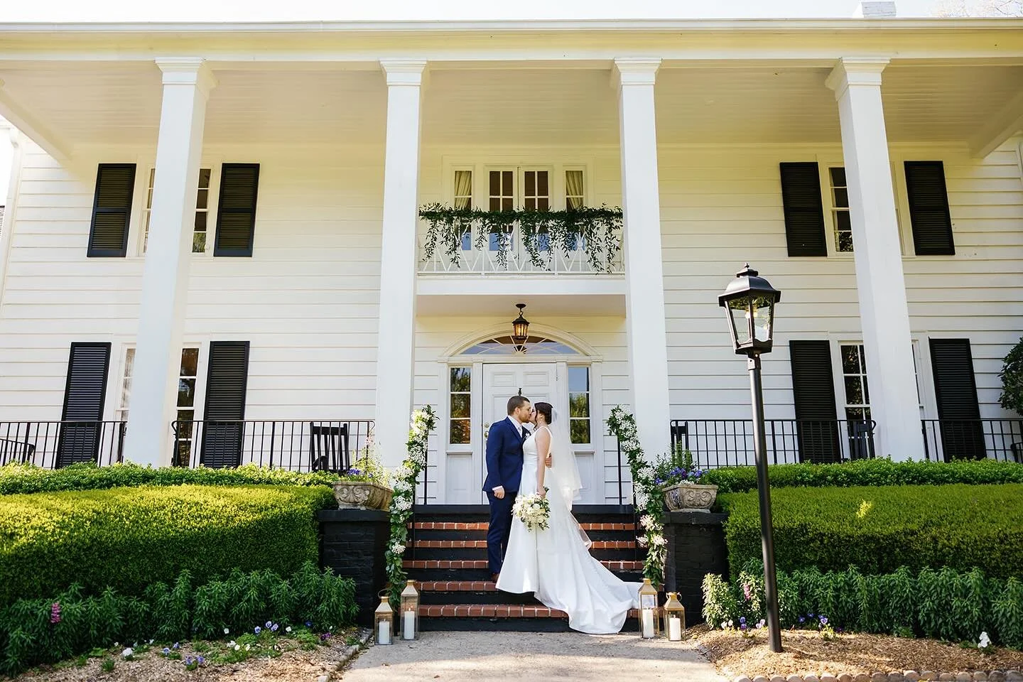 Our stunning couple graces the doorstep of Little Gardens’ mansion, where timeless elegance meets floral romance. From the embellished railings to the balcony above, every detail is a storybook moment waiting to be captured.
Come explore Littl