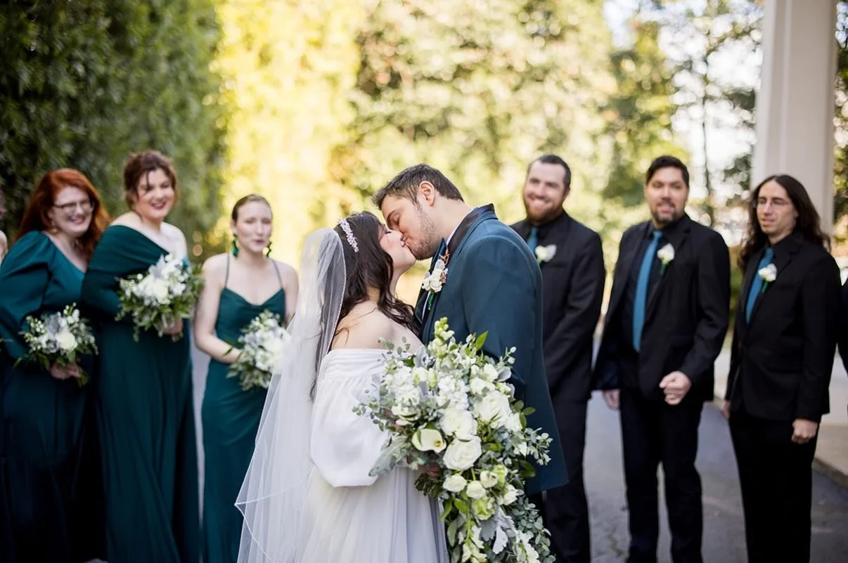 A winter’s day wrapped in romance. 
The cooler temps have winter weddings on the mind and this beauty was true perfection. Our bride stuns in a whimsical long-sleeve gown and her cascading bouquet of winter whites and greens surrounded by bride