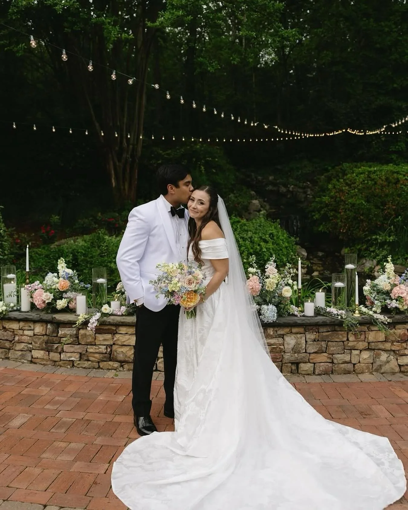 All dressed up and ready to set the stage.
Our waterfall stone wall never looked better&mdash;layered in florals, glowing with candlelight, and serving as the ultimate backdrop for a Natalie House love story. 

Come explore Natalie House where not on