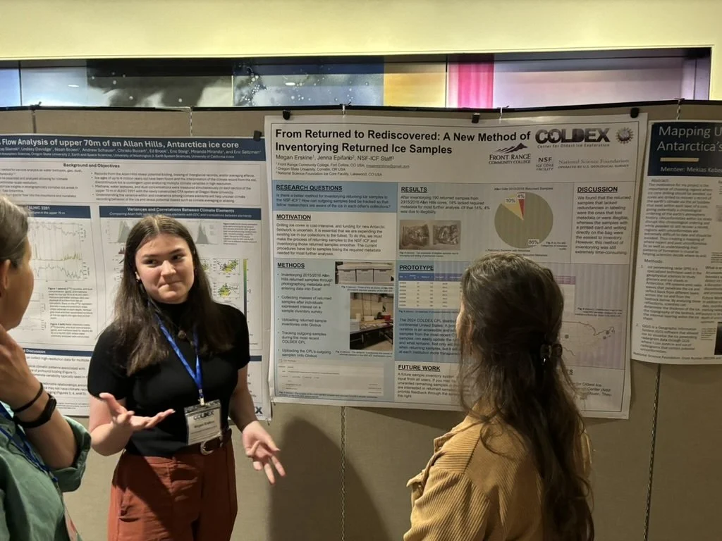 REU student Megan Erskine explaining her research to conference goers.