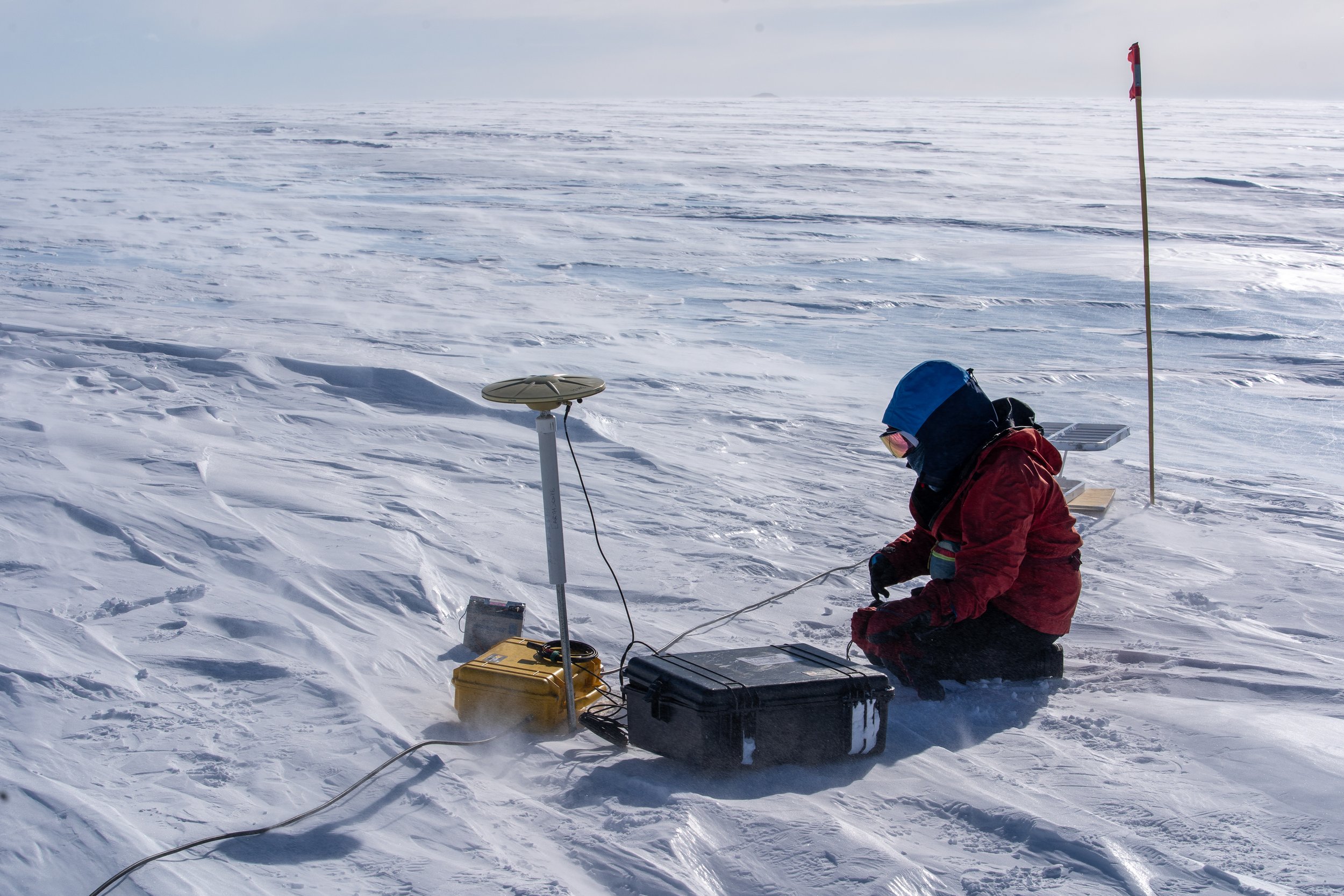 Geophysics Lead An Li tends to GPS and ApRES equipment while in the field at the Allan Hills during the 2025-2026 field season. Photo by Martin Froger Silva.
