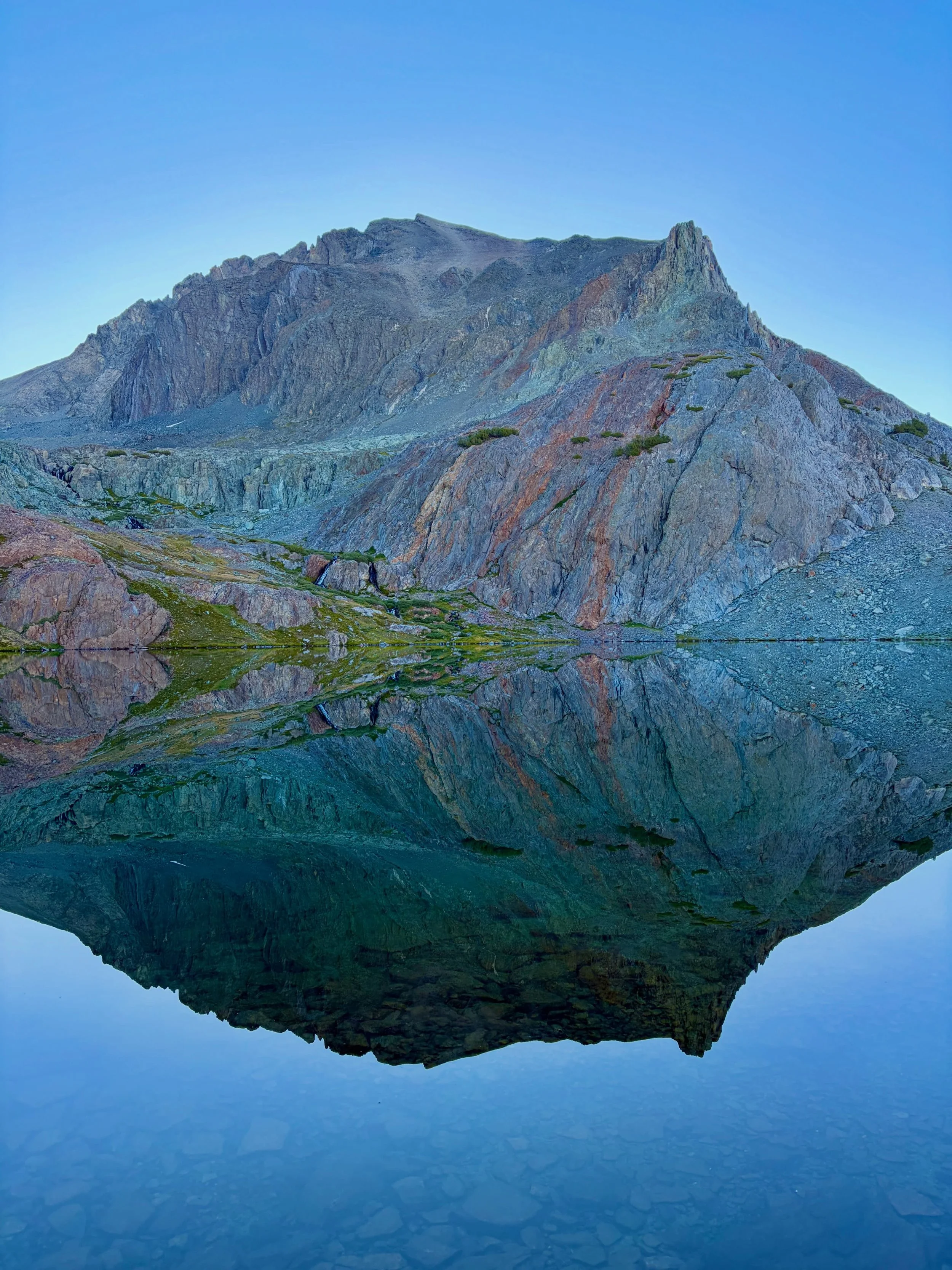 Sierra trip day 3. We woke up to the calmest morning and enjoyed the lake&rsquo;s perfect reflection of Mount Goddard. We spent the day walking through the rocky, high alpine basins of Ionian Basin. We saw just as many people as we saw trees: 0. We s