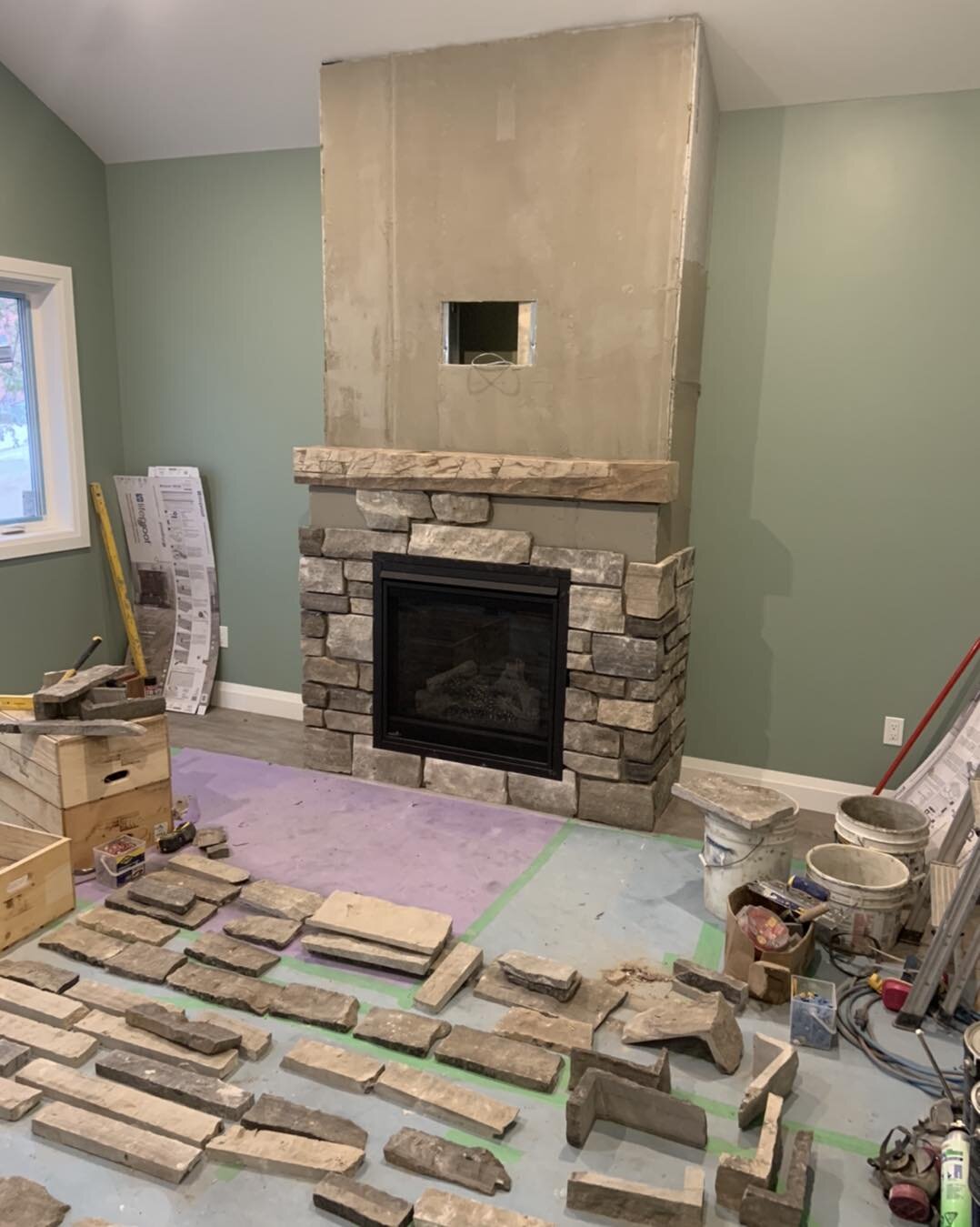 Very please with how the fireplace is coming along.  Old English Blend veneer stone.  Mortar in the joints tomorrow and shes done!