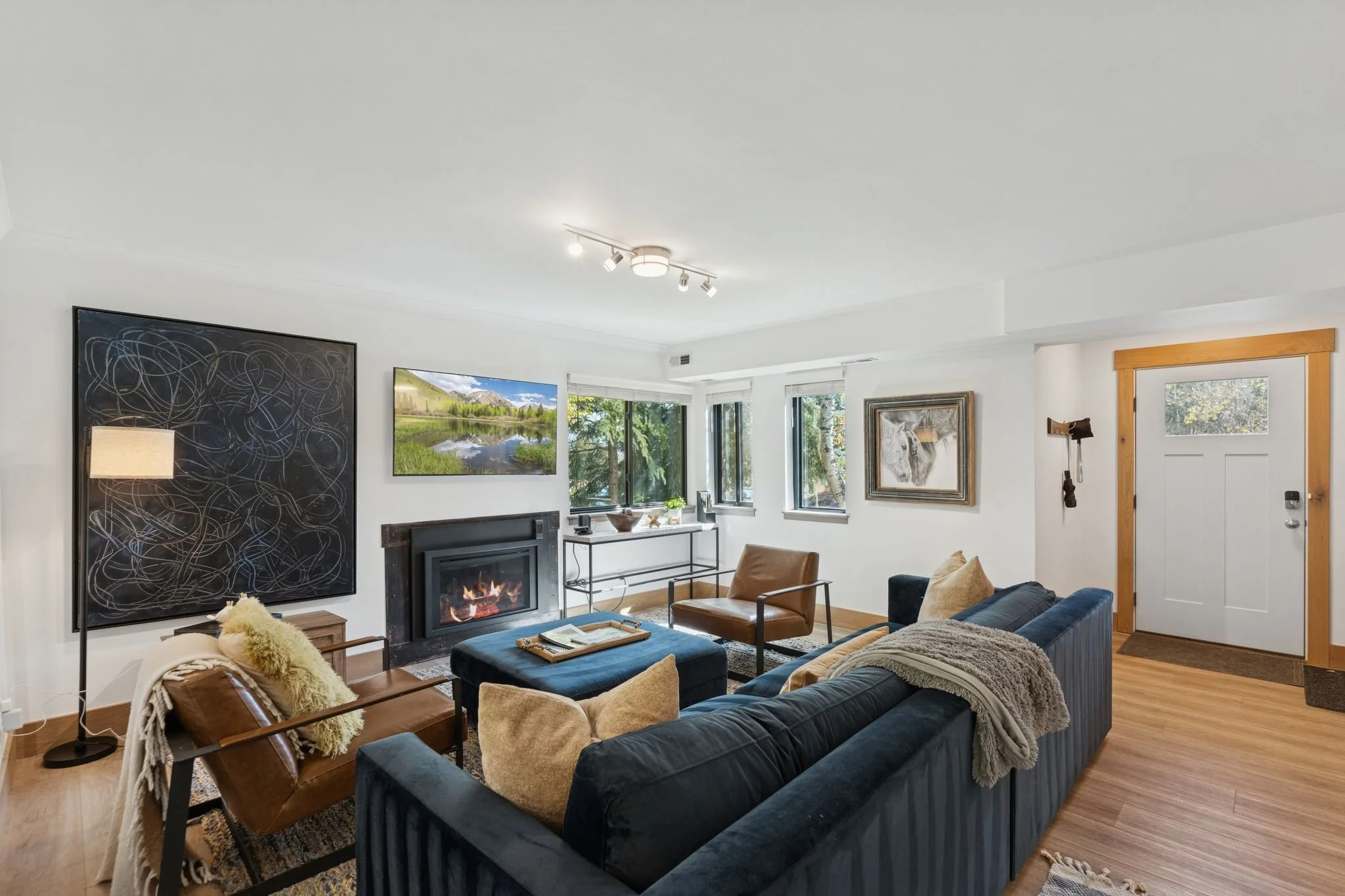 Lower Level Family Room with Gas Fireplace and 65” TV Cable, Prime and Netflix Streaming Services