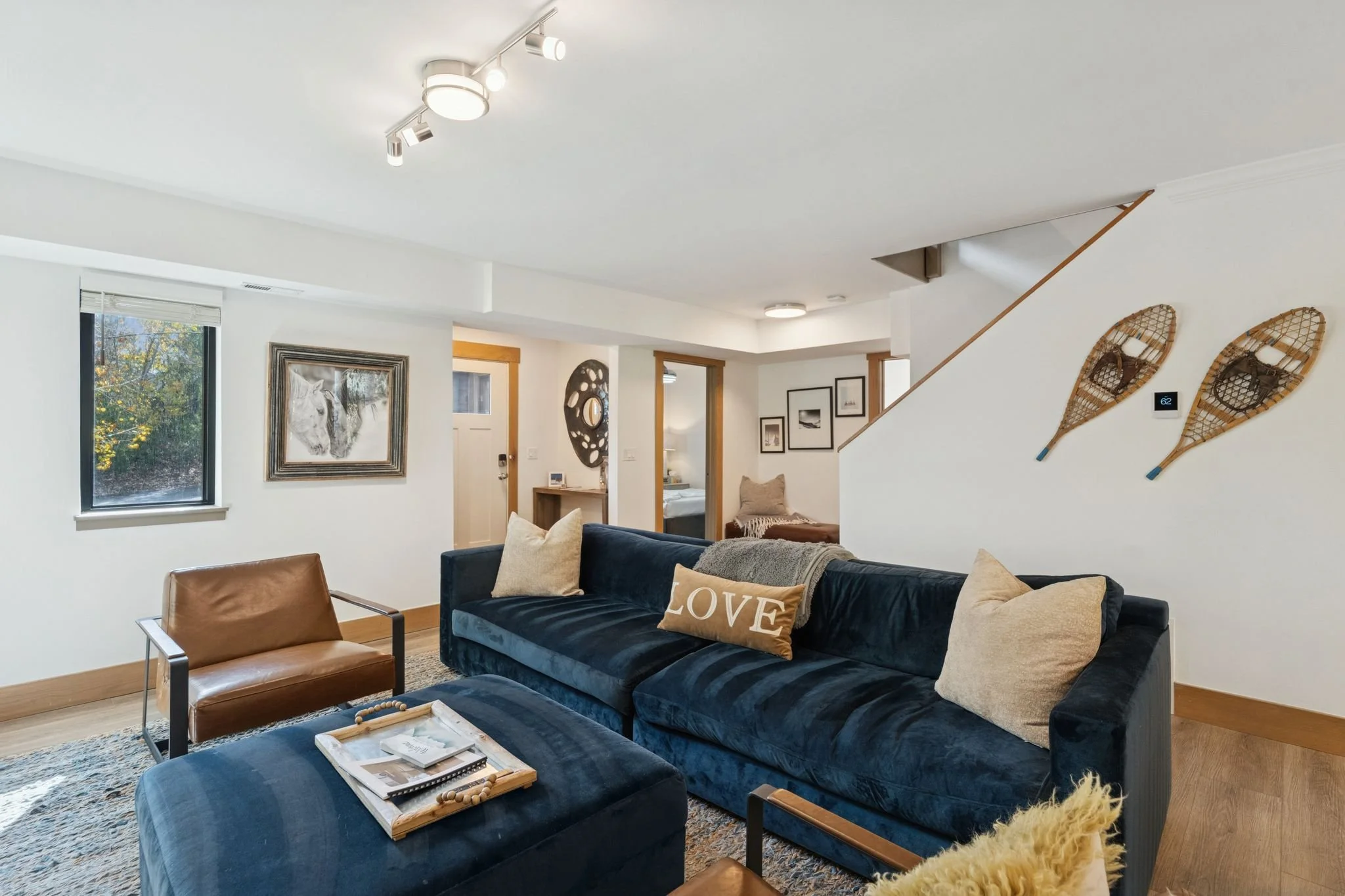 Lower Level Family Room with Gas Fireplace and 65” TV Cable, Prime and Netflix Streaming Services