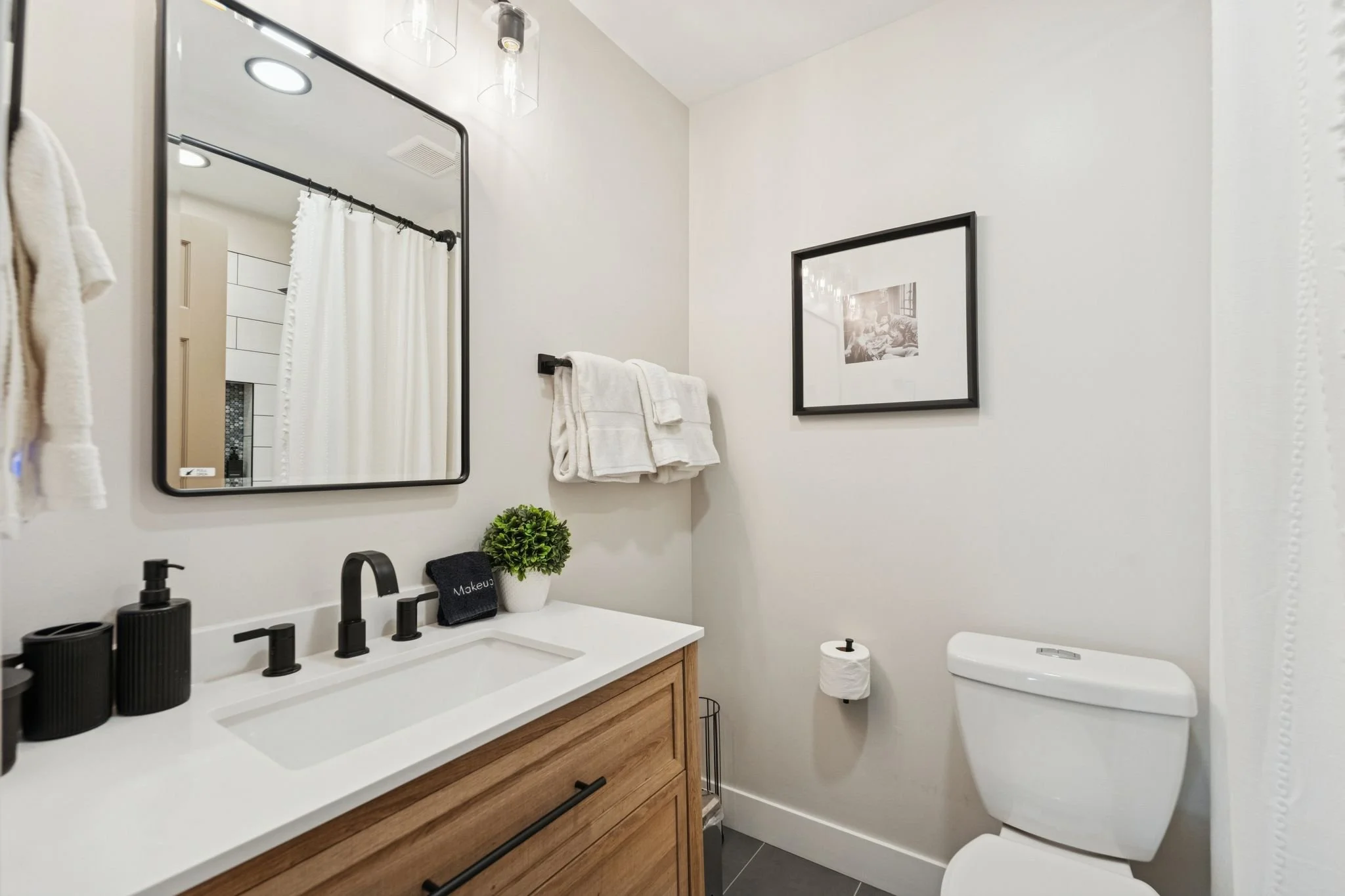 Newly renovated upstairs full bathroom with bathtub and shower. 