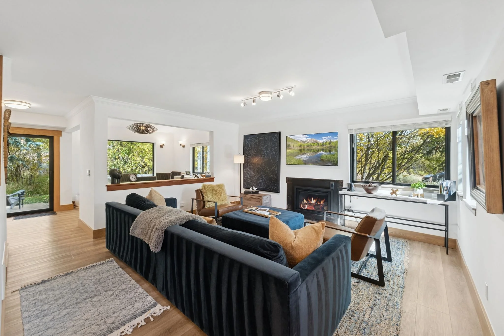 Lower Level Family Room with Gas Fireplace and 65” TV Cable, Prime and Netflix Streaming Services