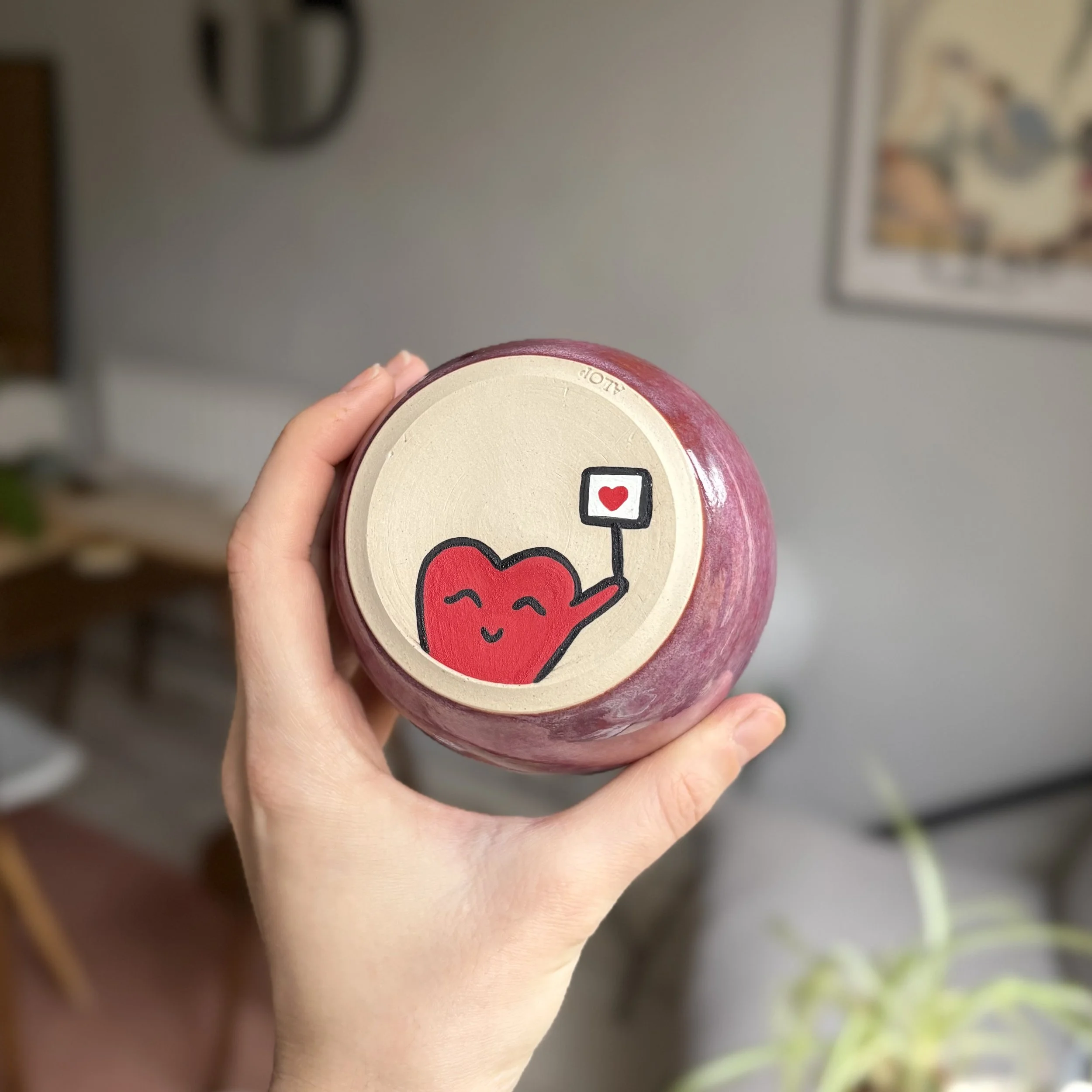 Heart holding a photo of himself, bold