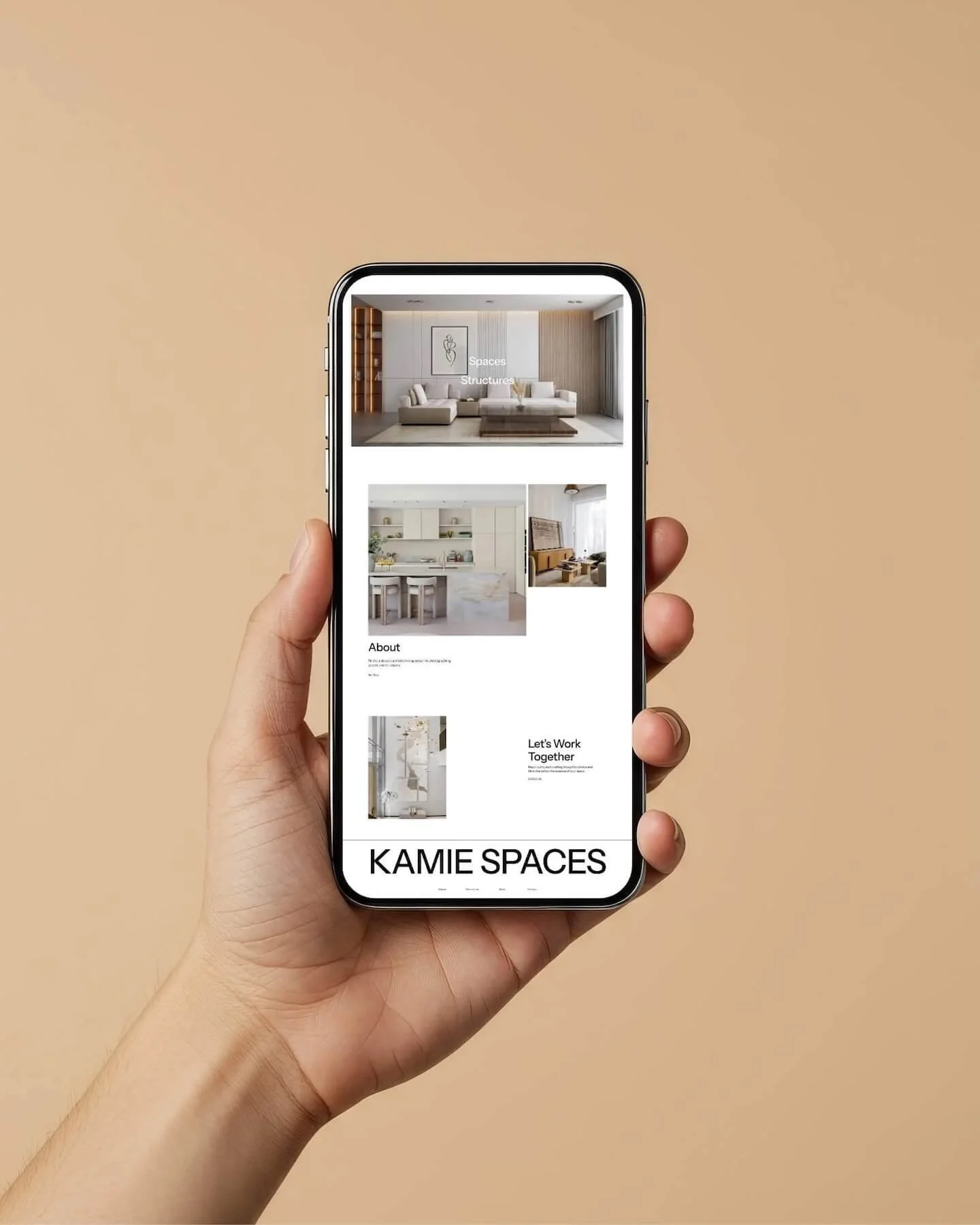 Hand holding a mobile phone with minimal Squarespace website design loaded on neutral background