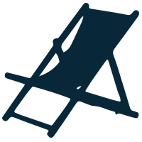 Camping chair with a small folding table on a grassy field