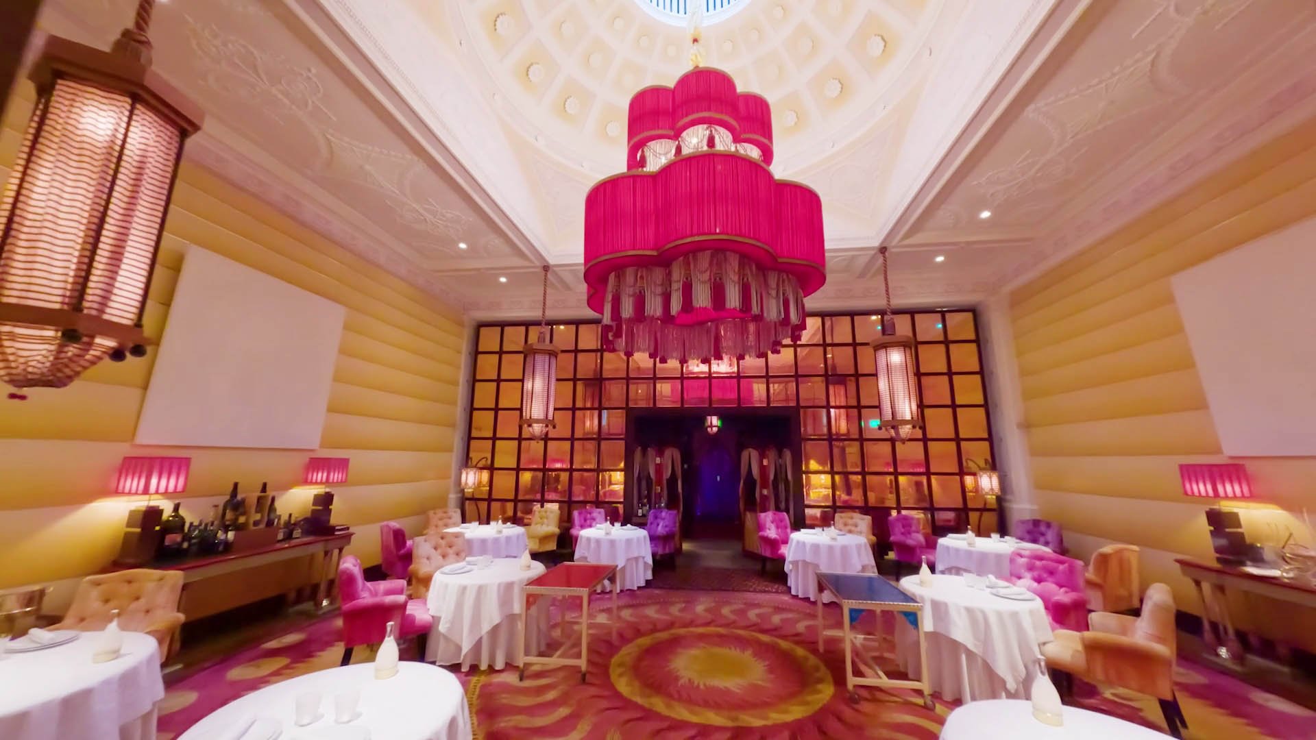 FPV drone view inside Sketch London in Mayfair, showing the distinctive luxury restaurant interior, architectural design and immersive hospitality space.