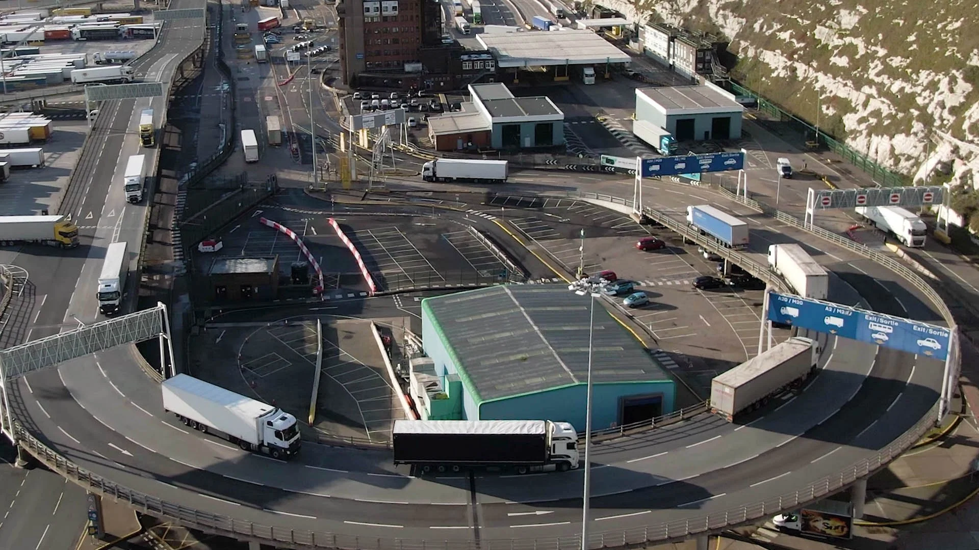 Aerial drone view of the Port of Dover, showing the ferry terminals, harbour infrastructure, ships and the busy English Channel gateway on the Kent coast.