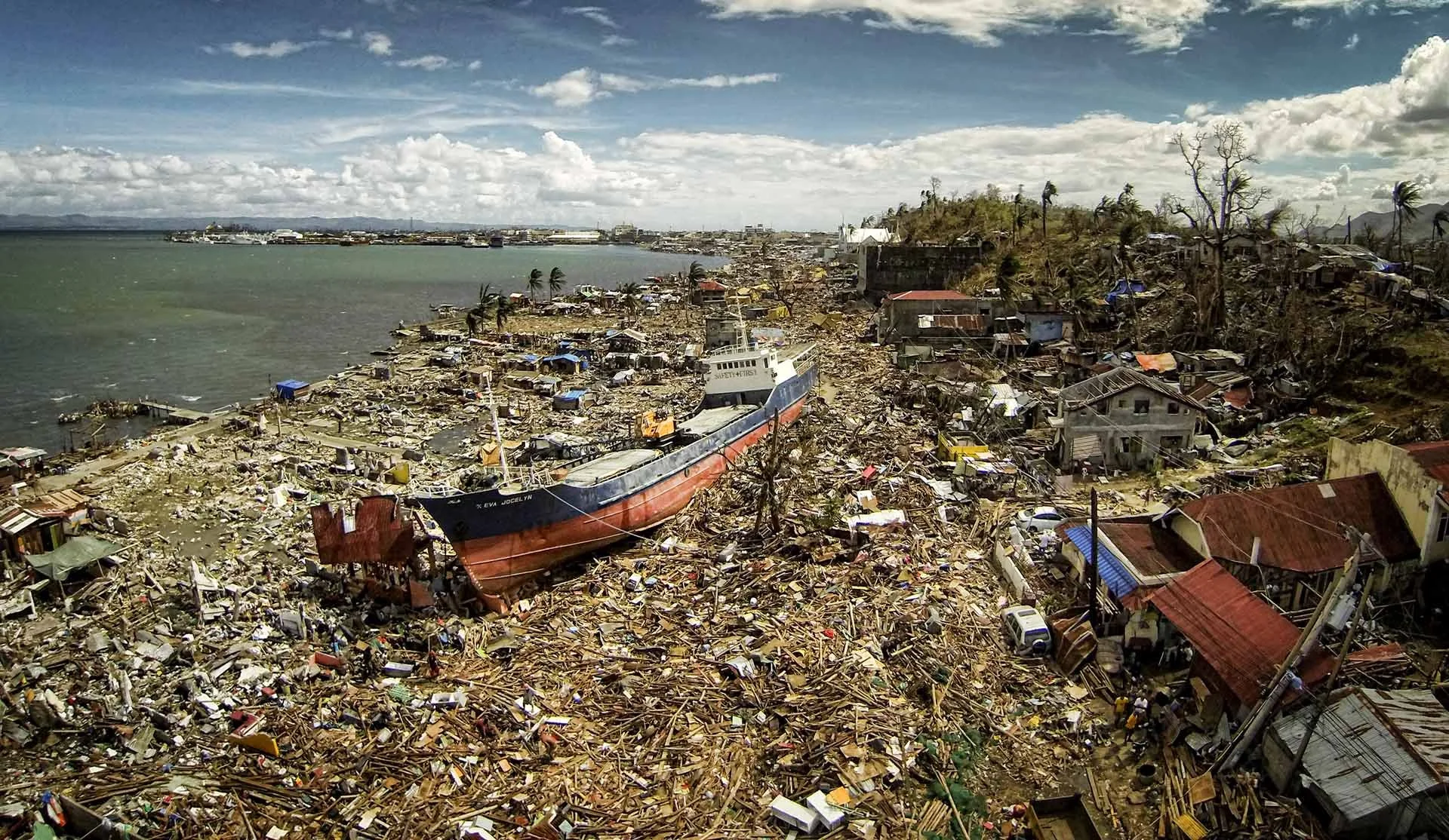 Aerial drone view of Tacloban in the Philippines after Typhoon Haiyan, showing widespread storm damage, destroyed buildings and the scale of the disaster across the city.