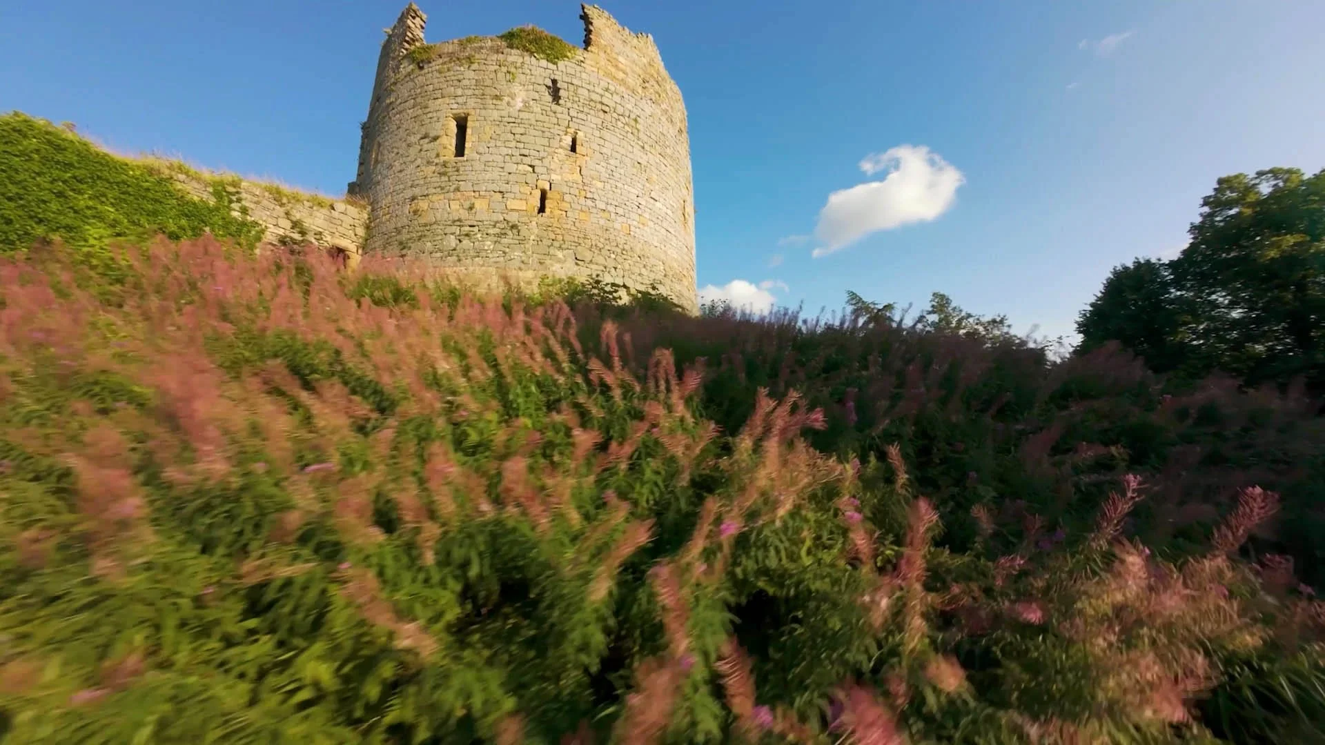 FPV drone view at Hawarden Estate, showing the historic estate, event spaces, surrounding landscape and live festival atmosphere in North Wales.