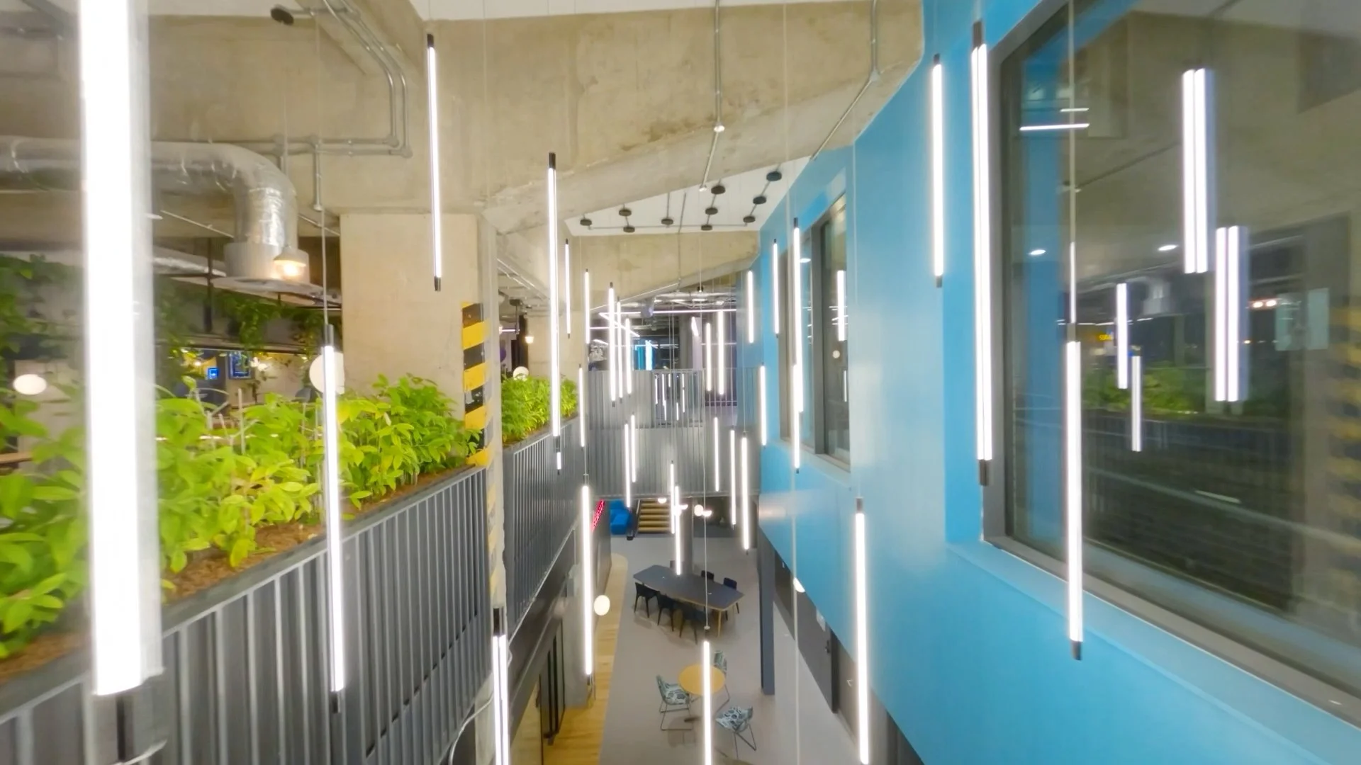 FPV drone fly-through Warner Bros. Discovery’s London headquarters, showing the office interior and workspace.