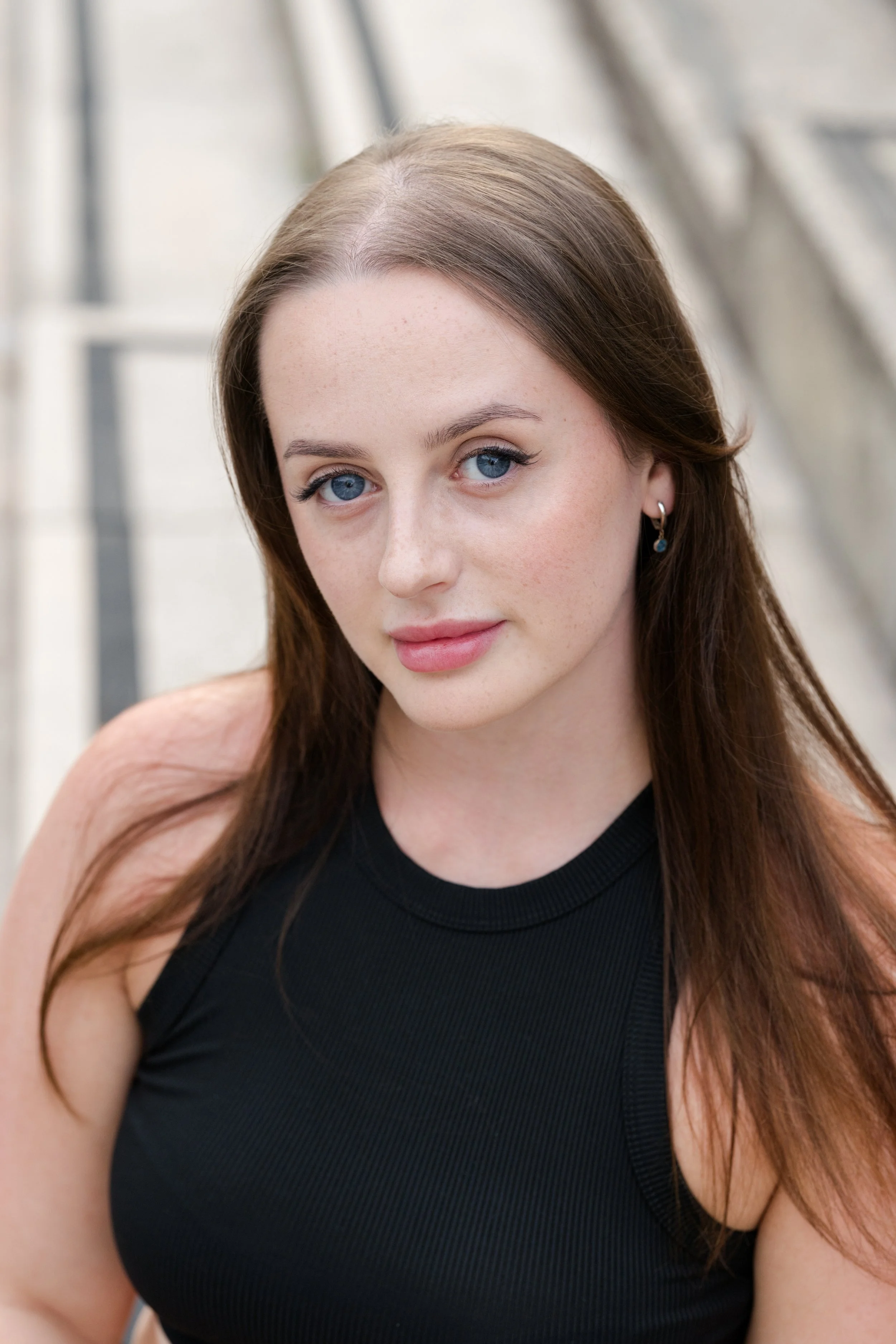 Relaxed outdoor headshot of a young professional in Lancaster