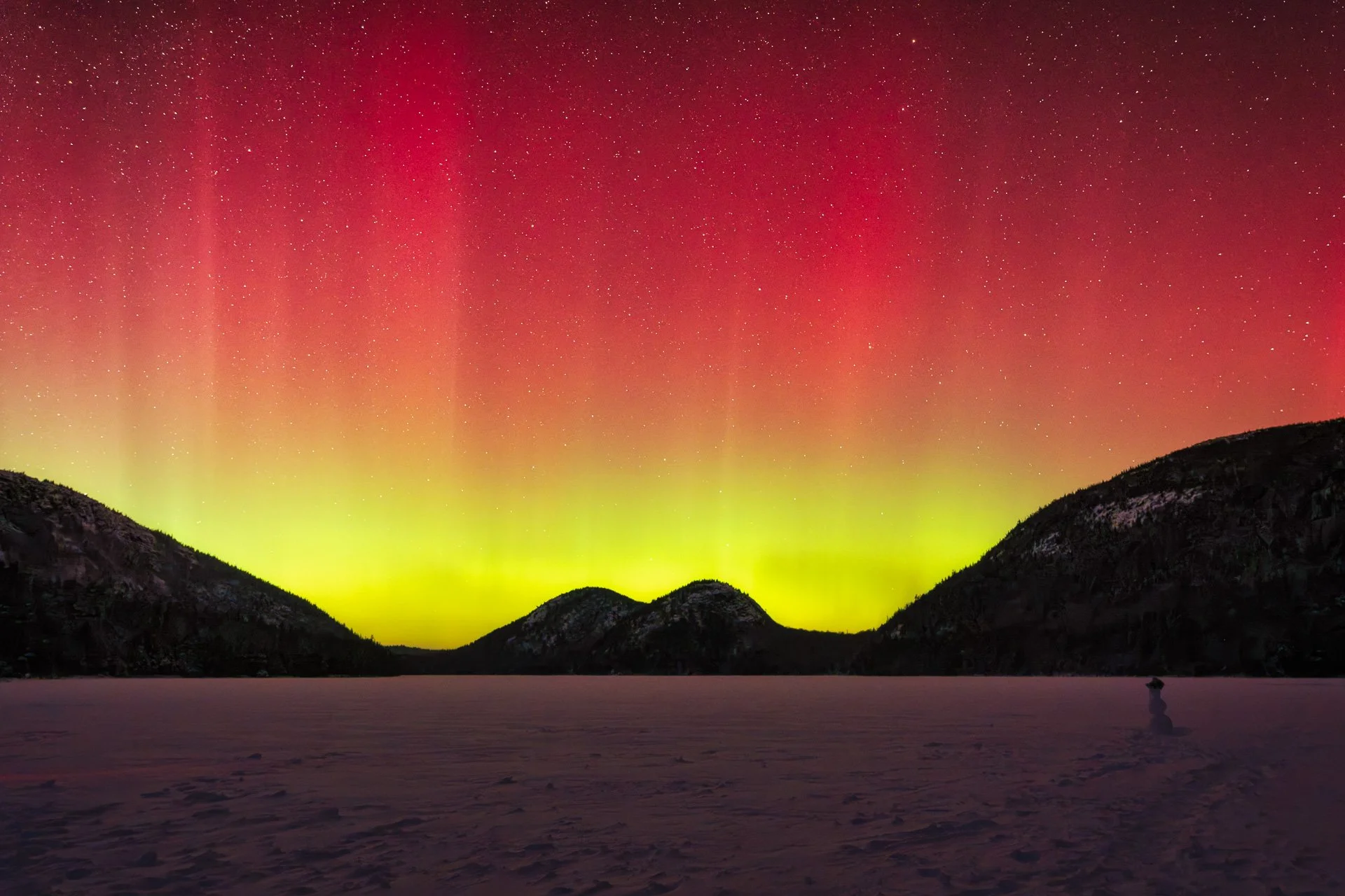 Winter Northern Lights display over Jordan Pond in Acadia National Park