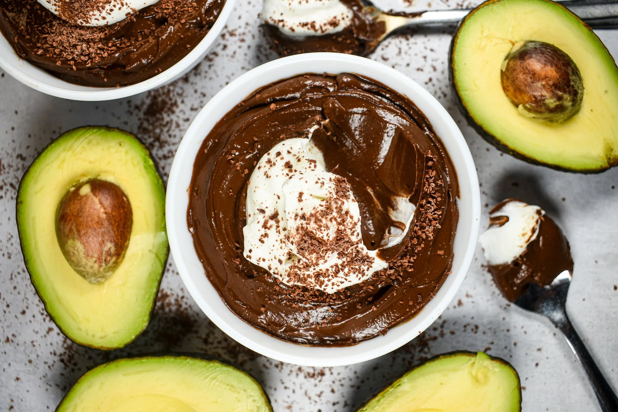 Whipped cream garnished avocado chocolate mousse
