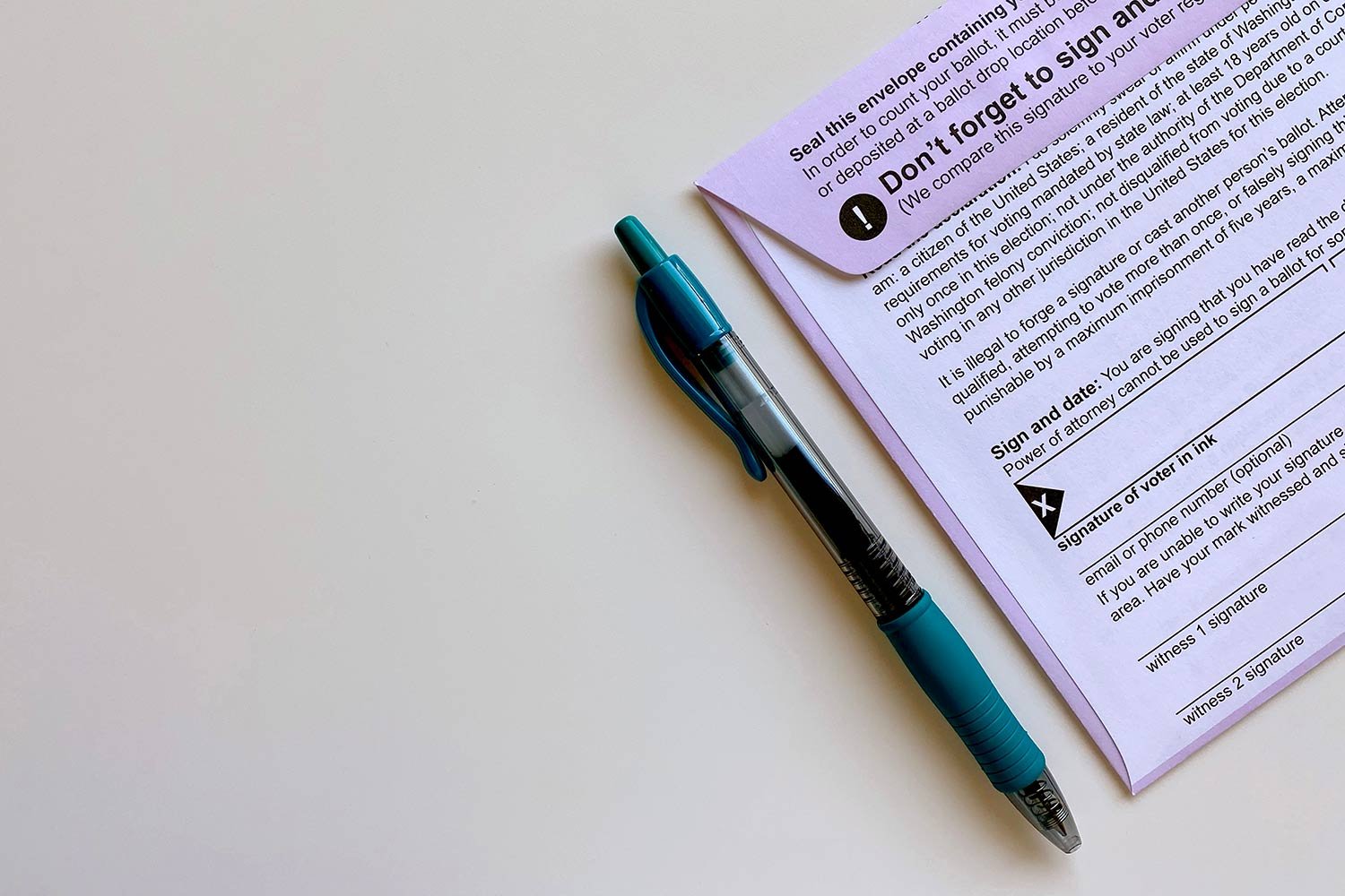 Mail-in ballot on table with pen