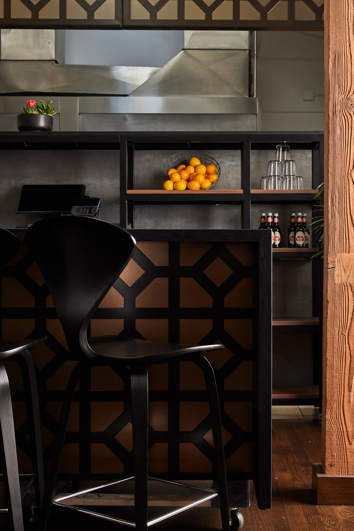  Bar seating featuring dramatic geometric panel details. 