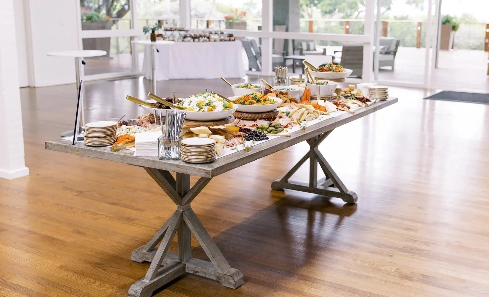 A grazing table covered with a wide variety of snacks at The Quad Conference Center.