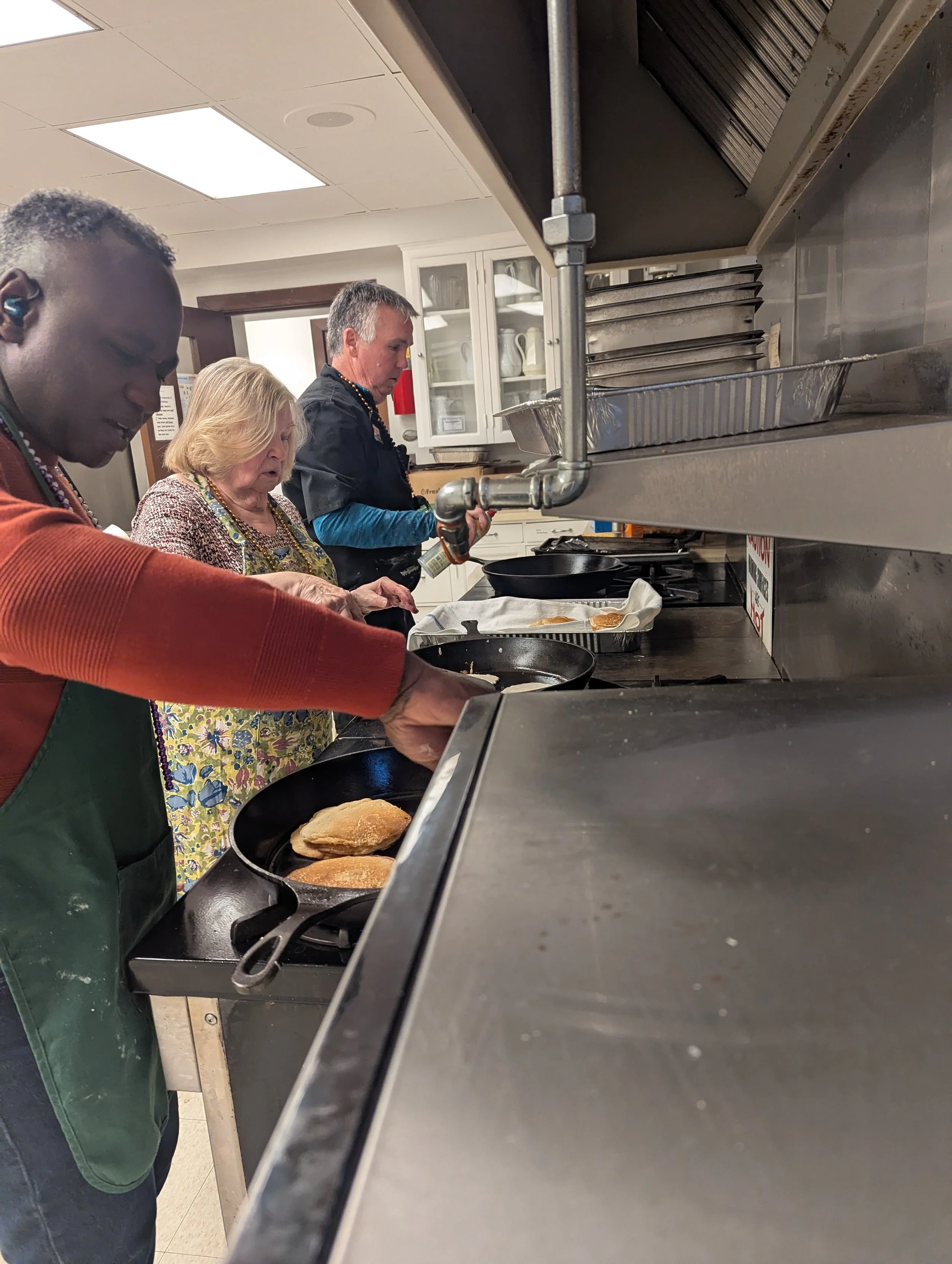 Kerry Peg and Bob cooking.jpg