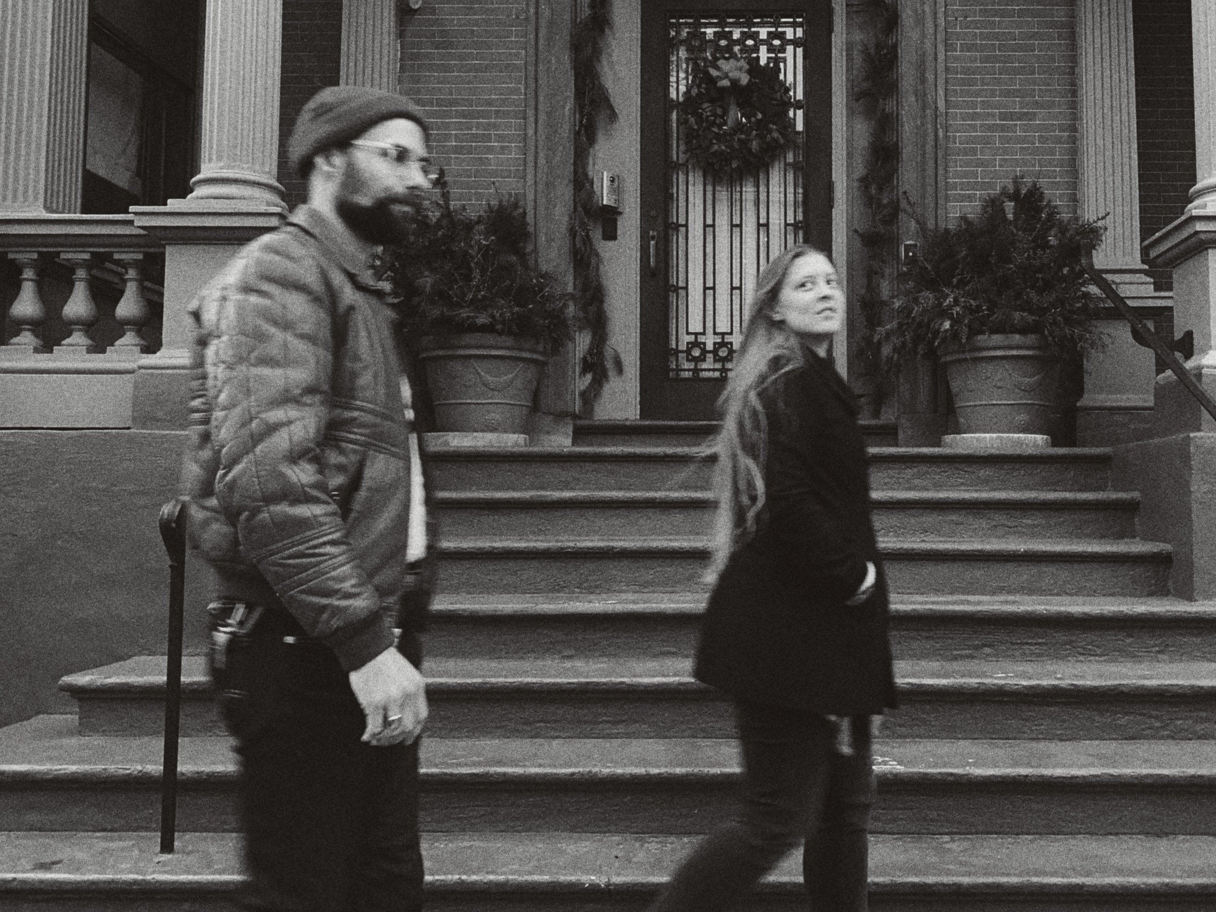 12.16.21 a&e walking in front of wreath B.jpg