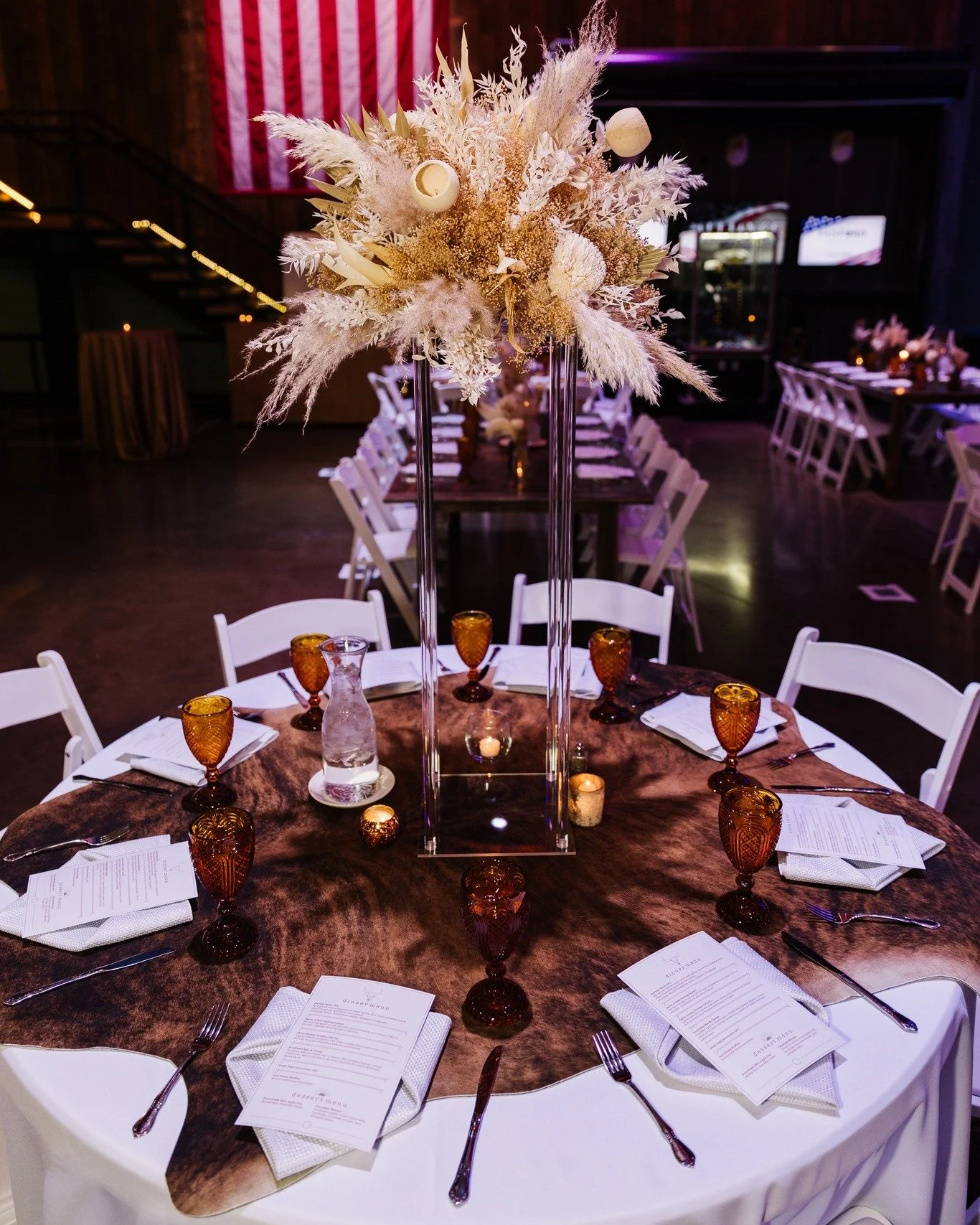 Who says rugs belong on the floor?
Our cowhide rugs bring depth and character when styled tableside&mdash;proof that great design lives in the details.

Photo By: Nicole Marie Photography
Planner: Serendipitous Events
Florals: The Flower Mill
Goblets